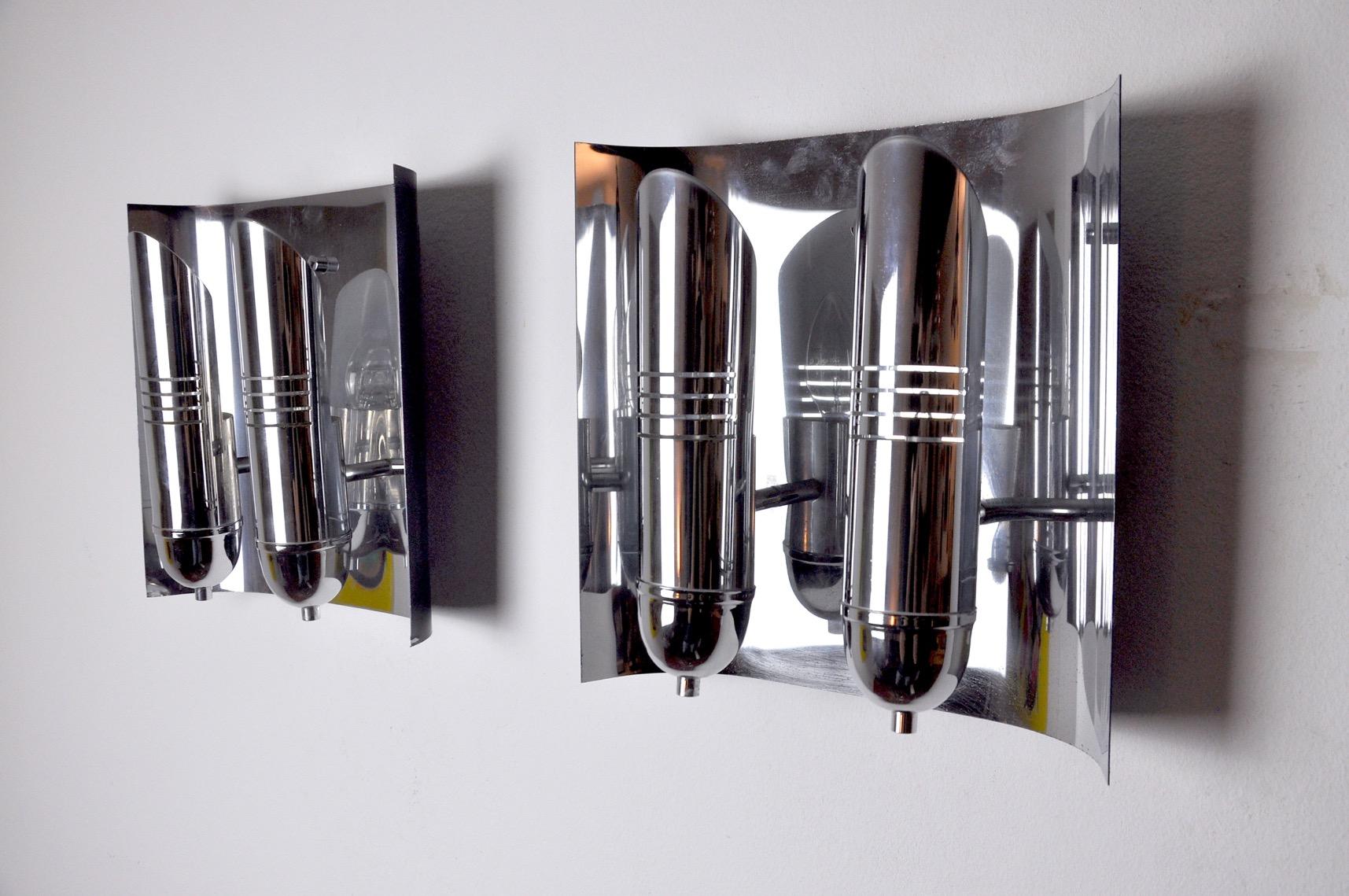 Pair of large tubular chrome wall lights designed and produced in Denmark in the 1970s. Unique object that will illuminate and bring a real designer touch to your interior. Electricity checked, mark of time relating to the age of the object. Easy