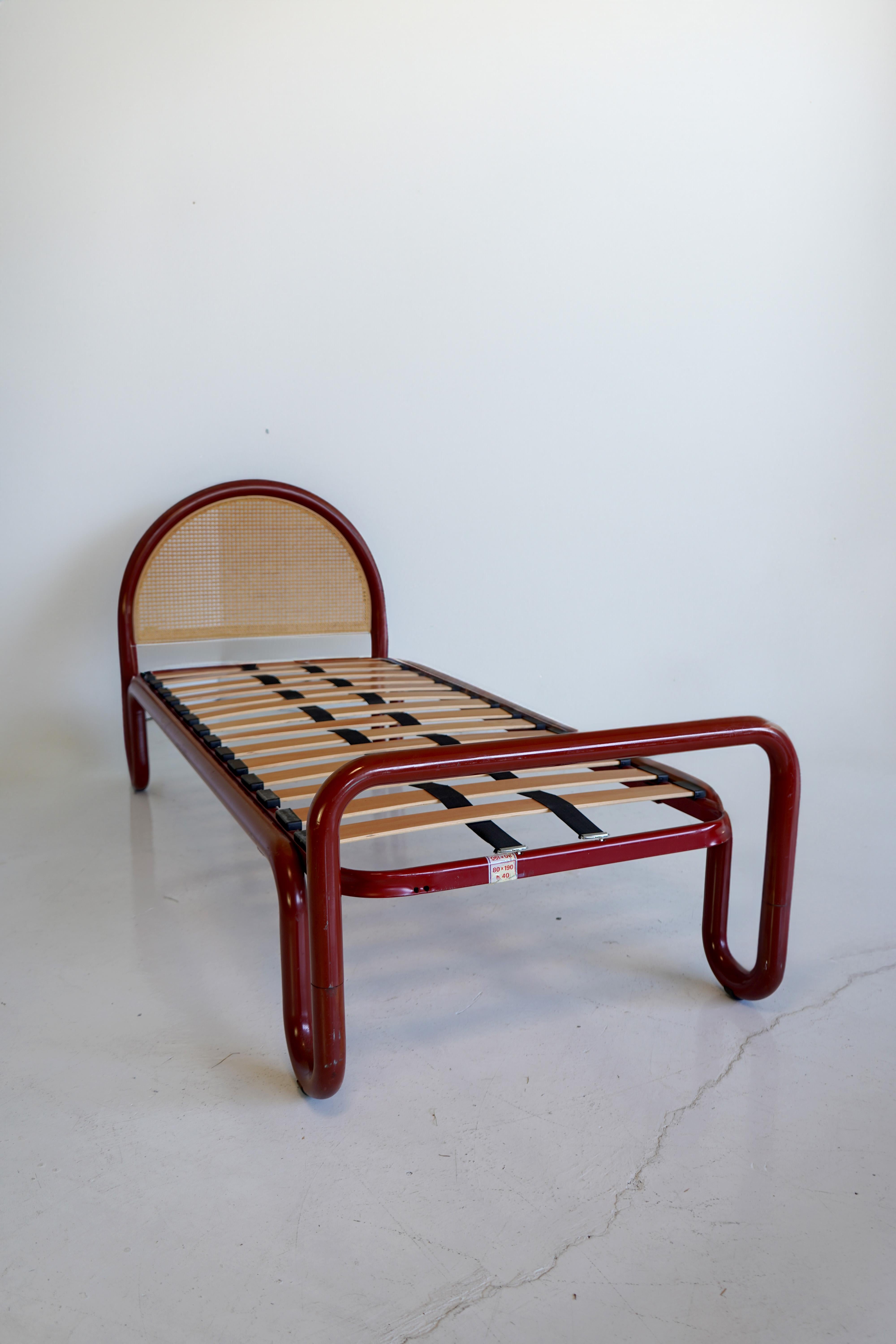 Playful yet elegant pair of vintage Italian beds in red tubular metal with cane headboard. One has had the springs replaced. Knicks to frame but cane is in excellent condition. 

Fits a uk small single mattress which is available for purchase online