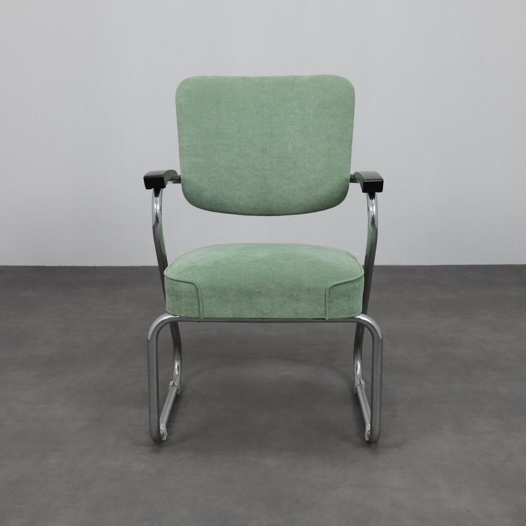 An exceptionally rare pair of Dutch modernist armchairs designed by Paul Schuitema and produced by Fana Metaal, Rotterdam, in the 1950s. These chairs embody the radical clarity and functional elegance that define early post-war European