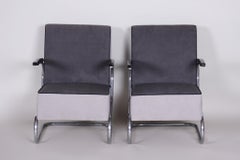 Paire de fauteuils cantilever en acier tubulaire Art Déco:: chromés:: tapisserie neuve
