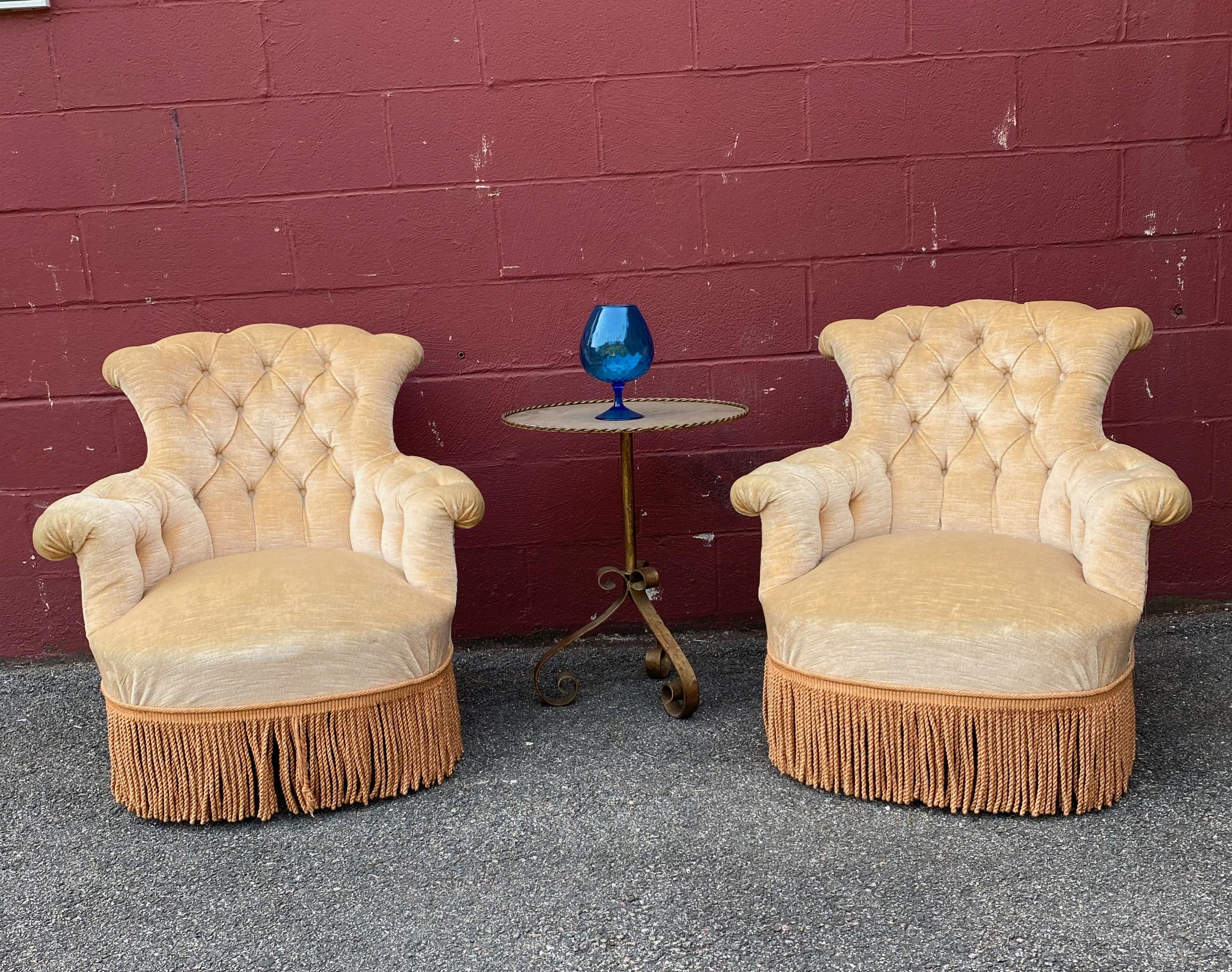 Pair of French tufted armchairs in tan fabric, sold as is.

 