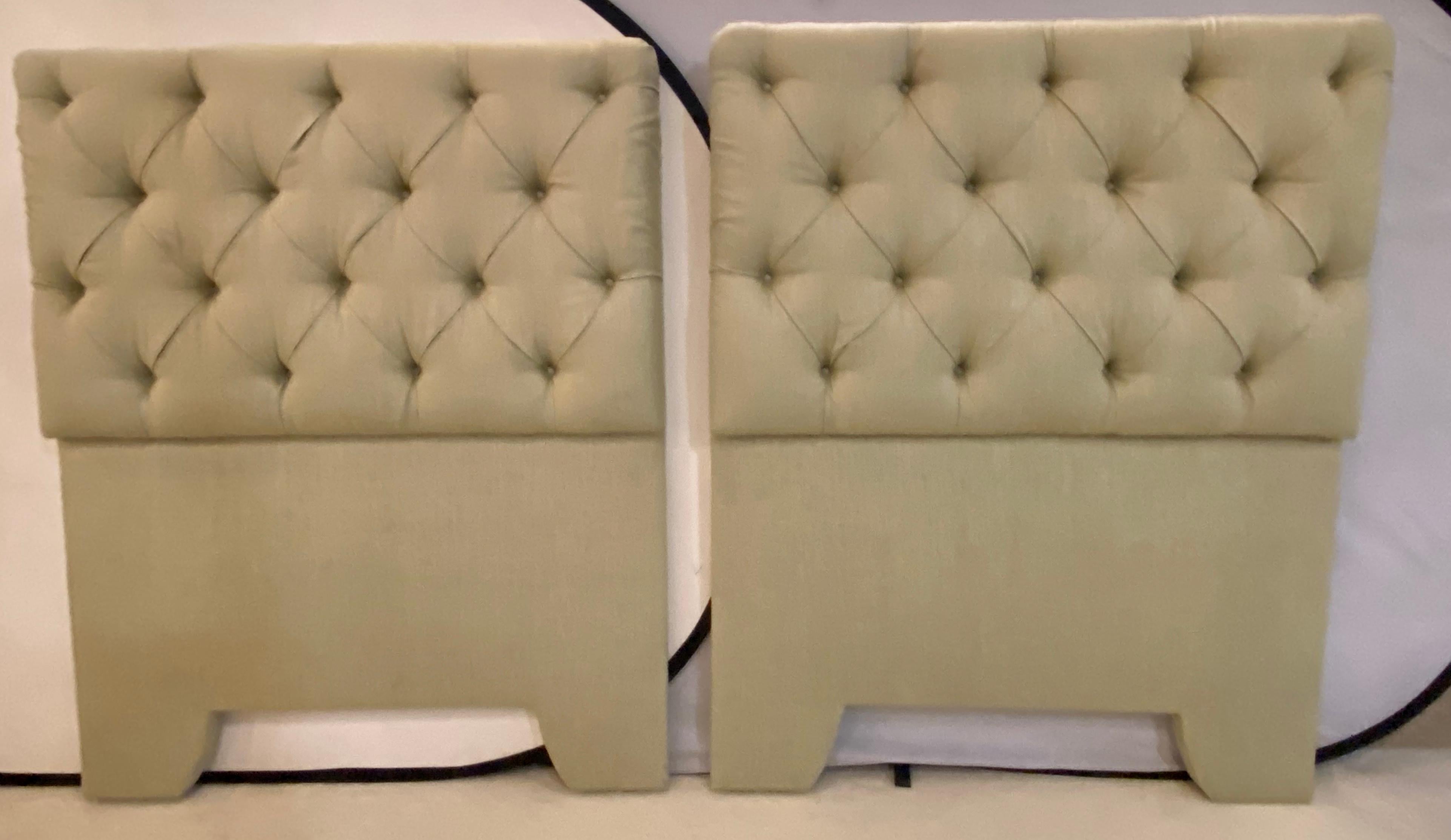 Pair of tufted linen twin headboards.