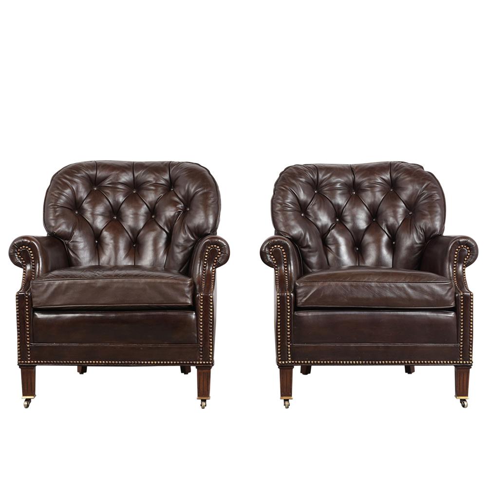 This pair of vintage Regency style leather club chairs 1970s by Hancock & Moore have been refurbished and are in excellent condition. This pair features its original dark brown color leather with tufted back design, brass nail-head detail around the