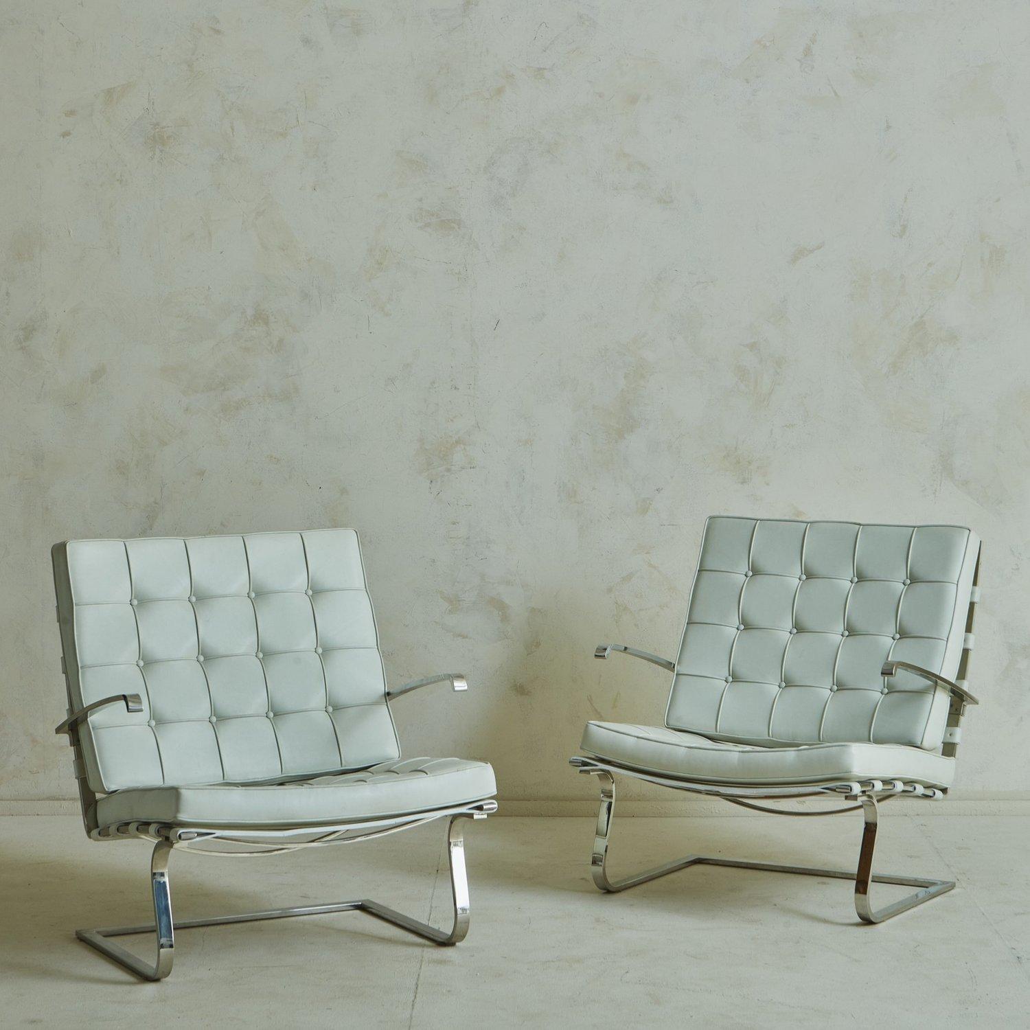 A pair of Tugendhat chairs in white leather designed by architect Mies Van Der Rohe in 1929 for one of his most distinguished projects: the Tugendhat Villa in Brno, Czech Republic. The design was originally manufactured in Germany by Berliner