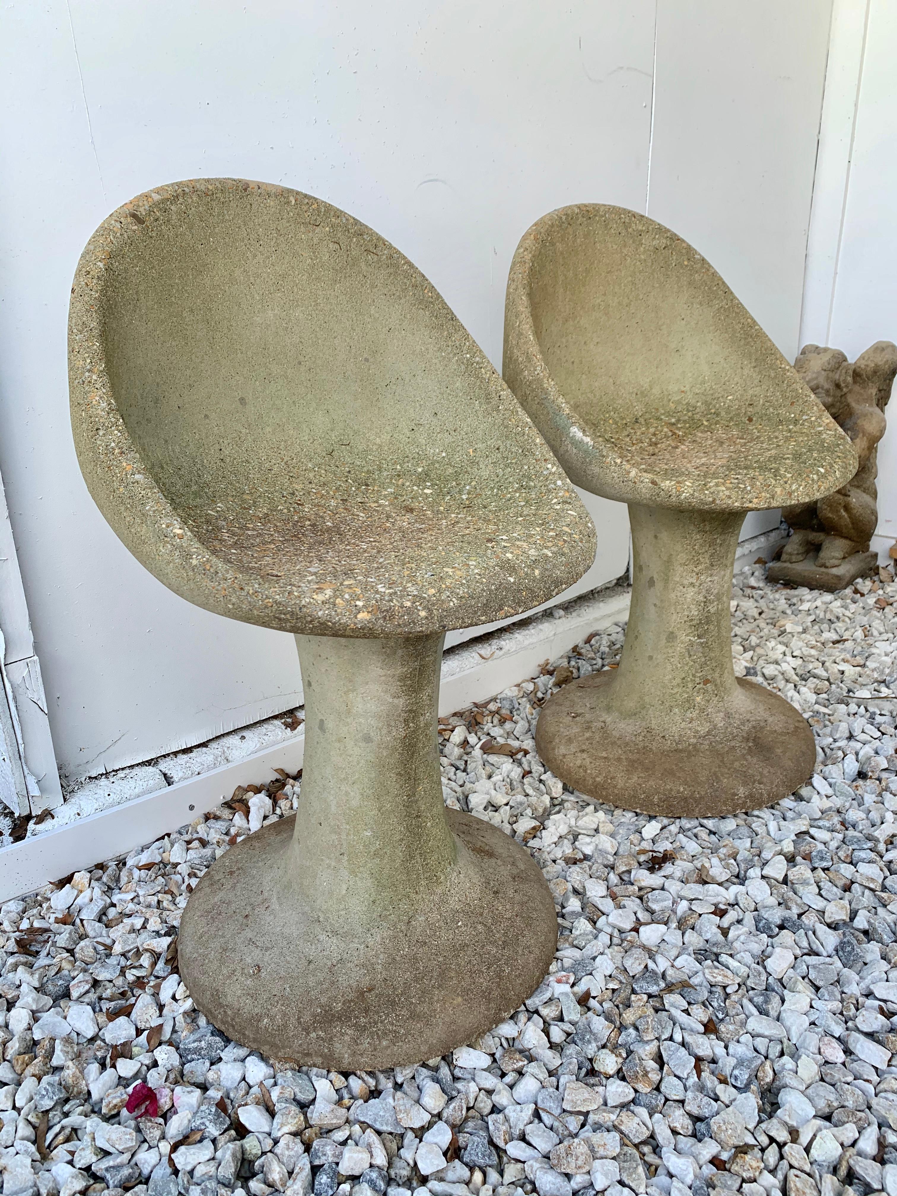 Unique pair of concrete aggregate chairs with a Tulip style base. Very unusual set of chairs and in very good condition. Extremely heavy and well made. Priced as a pair.
