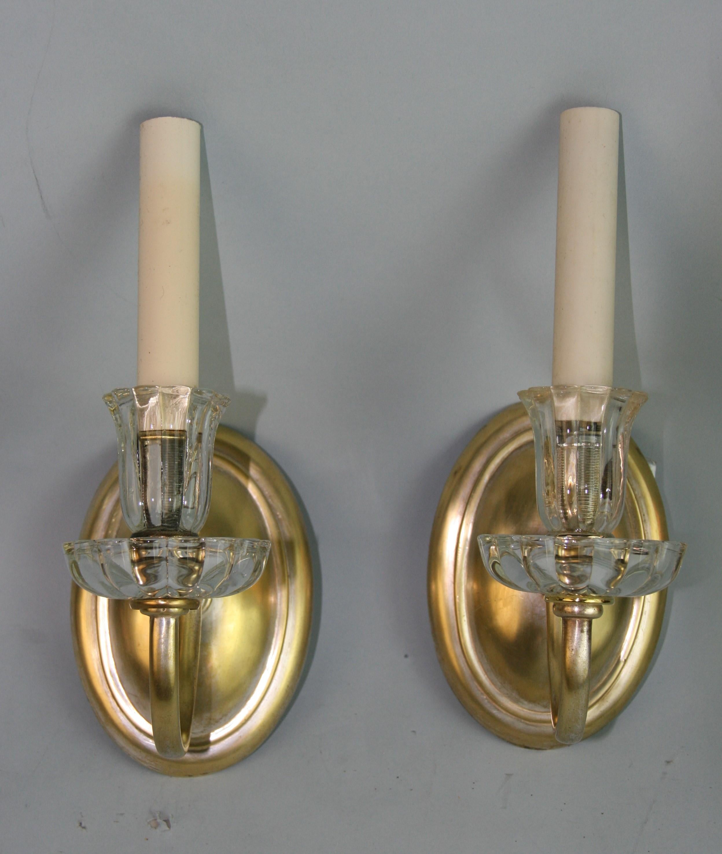 1395 pair brass and crystal sconces.