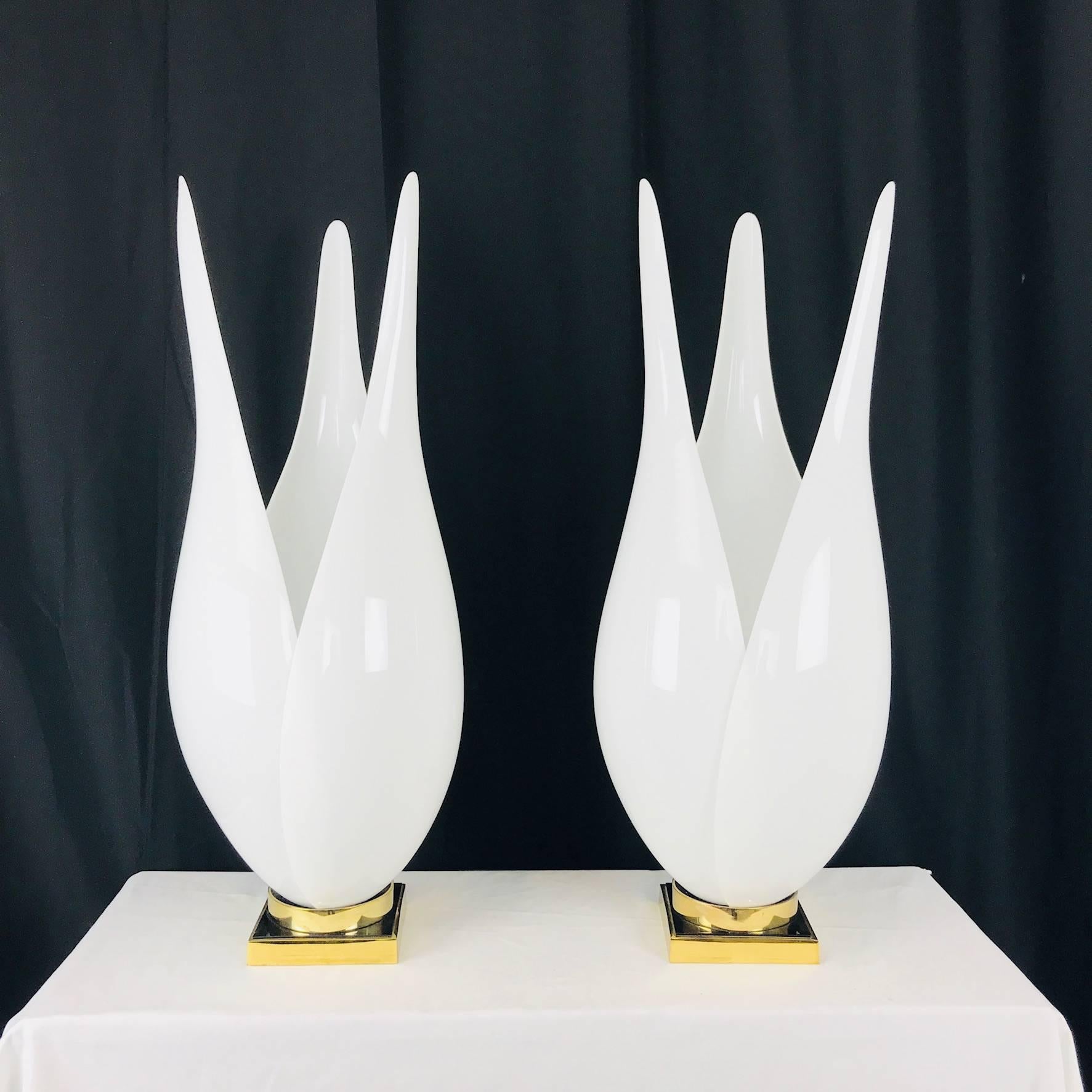 Pair of tulip lamps, by Rougier, with white Lucite petals and brass plated bases. In good vintage condition with wear from use and age.

Dimensions: 12