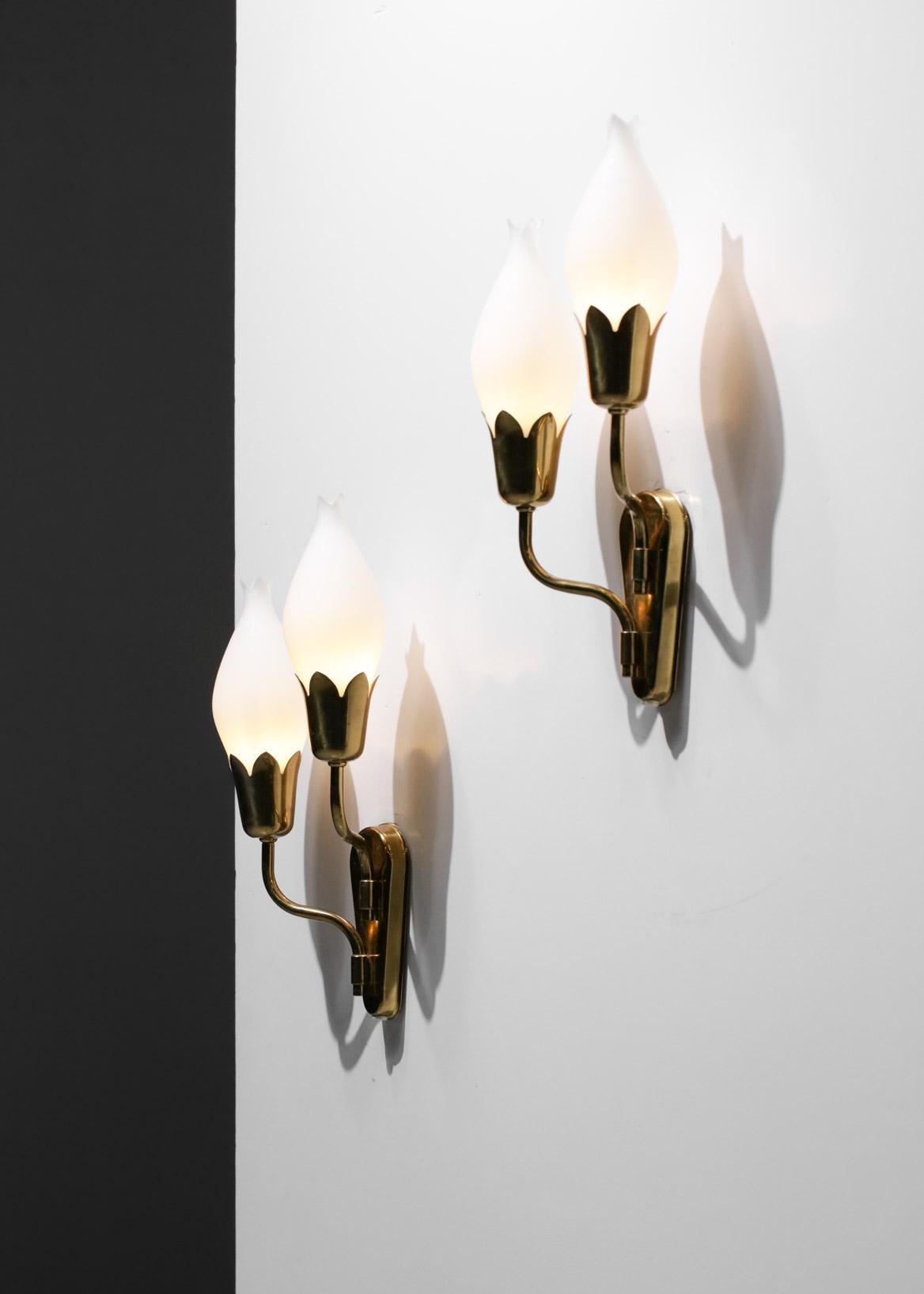 Nice pair of Scandinavian double wall lights from the 60's from Fog & Morup. Solid brass structure and opaque white opaline diffusers with a very nice 