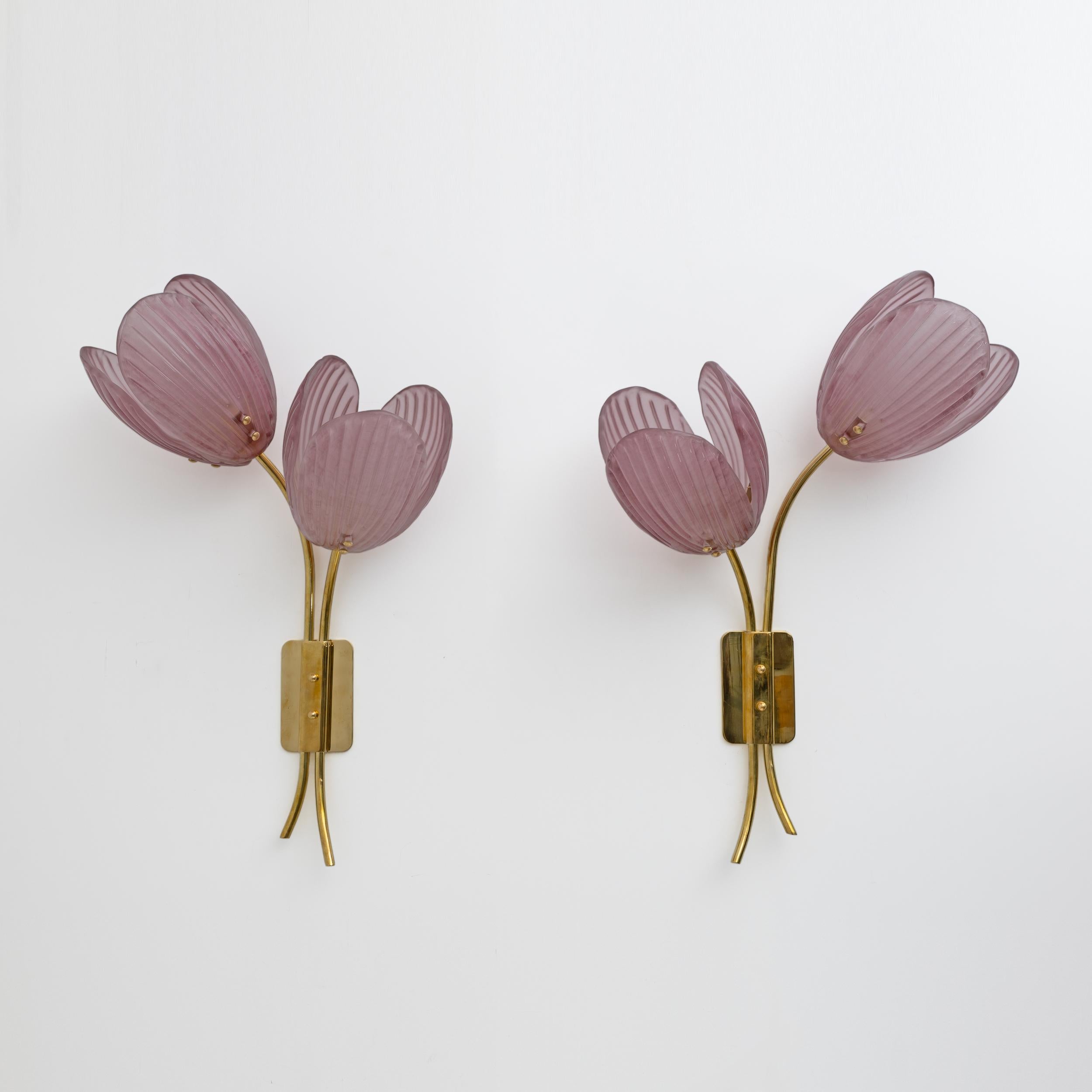 Pair of wall lamps, entirely handmade in Murano, Italy, that bring Nature and Feng Shui energy into your interior. This pair of modern organic wall lamps consists of a handmade brass support in the shape of a branch adorned with 2 Murano artistic