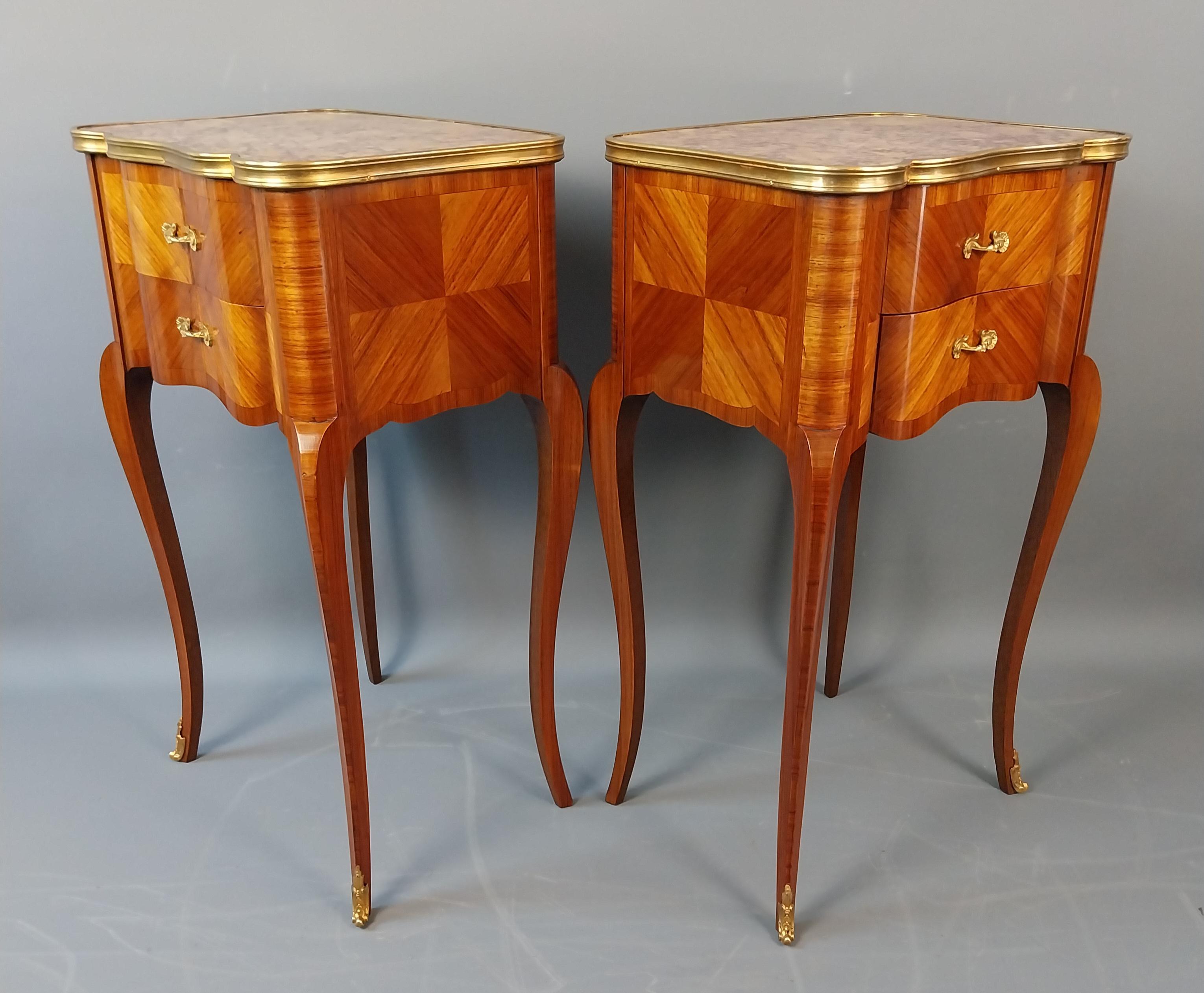 A quality Pair of petite Tulipwood Bedside Tables with segmented Tulipwood Veneers which make a striking pattern to the drawer fronts and sides, each cabinet has two oak lined dovetail jointed drawers and also benefit from superb serpentine shaped