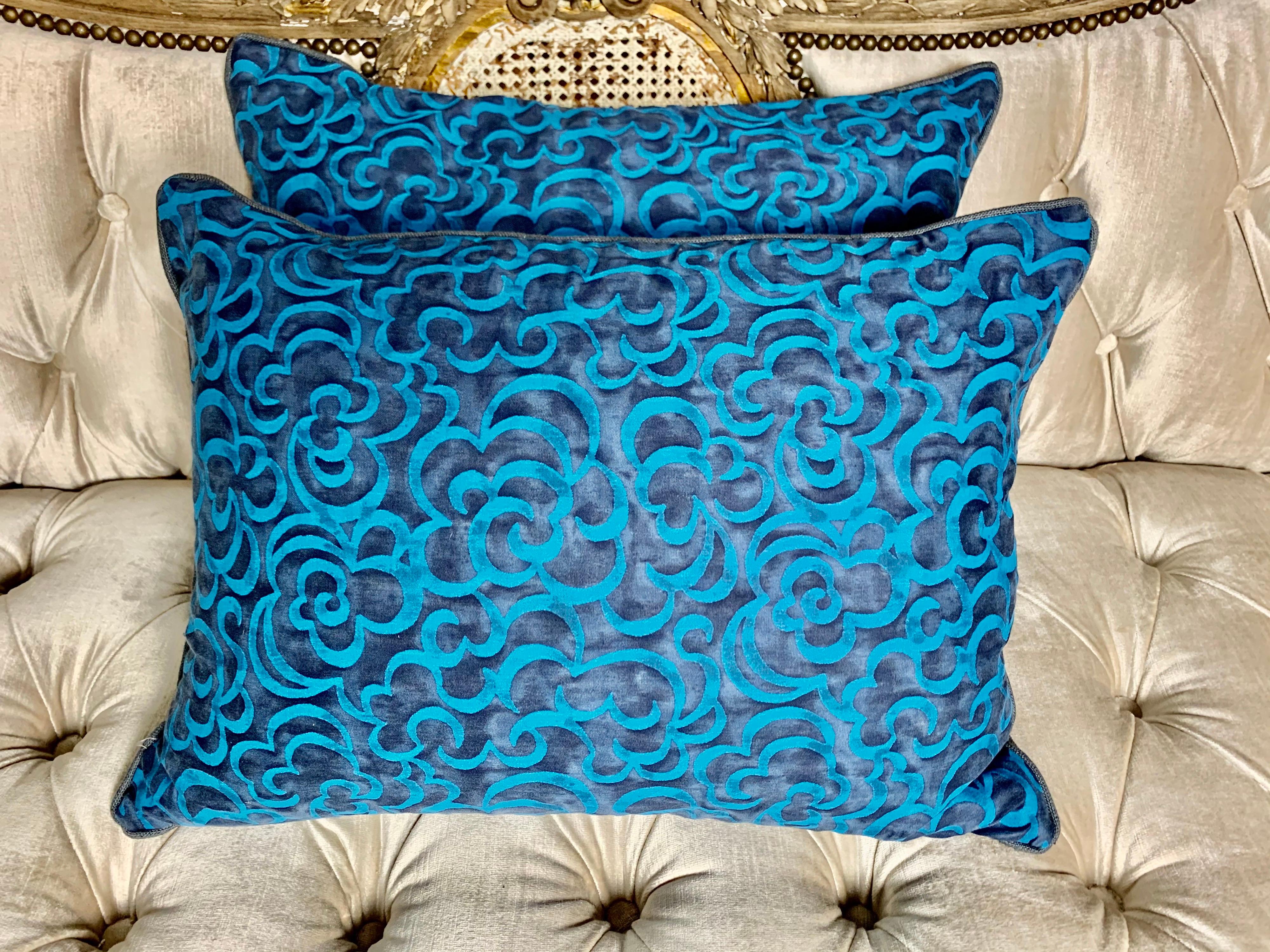 Pair of custom Fortuny Nuvole patterned pillows in Turkish blues. Nuvole Is the Italian word for clouds. The cotton Fortuny was printed in Italy as well. The backs are a coordinating linen. Self cording, down insert.