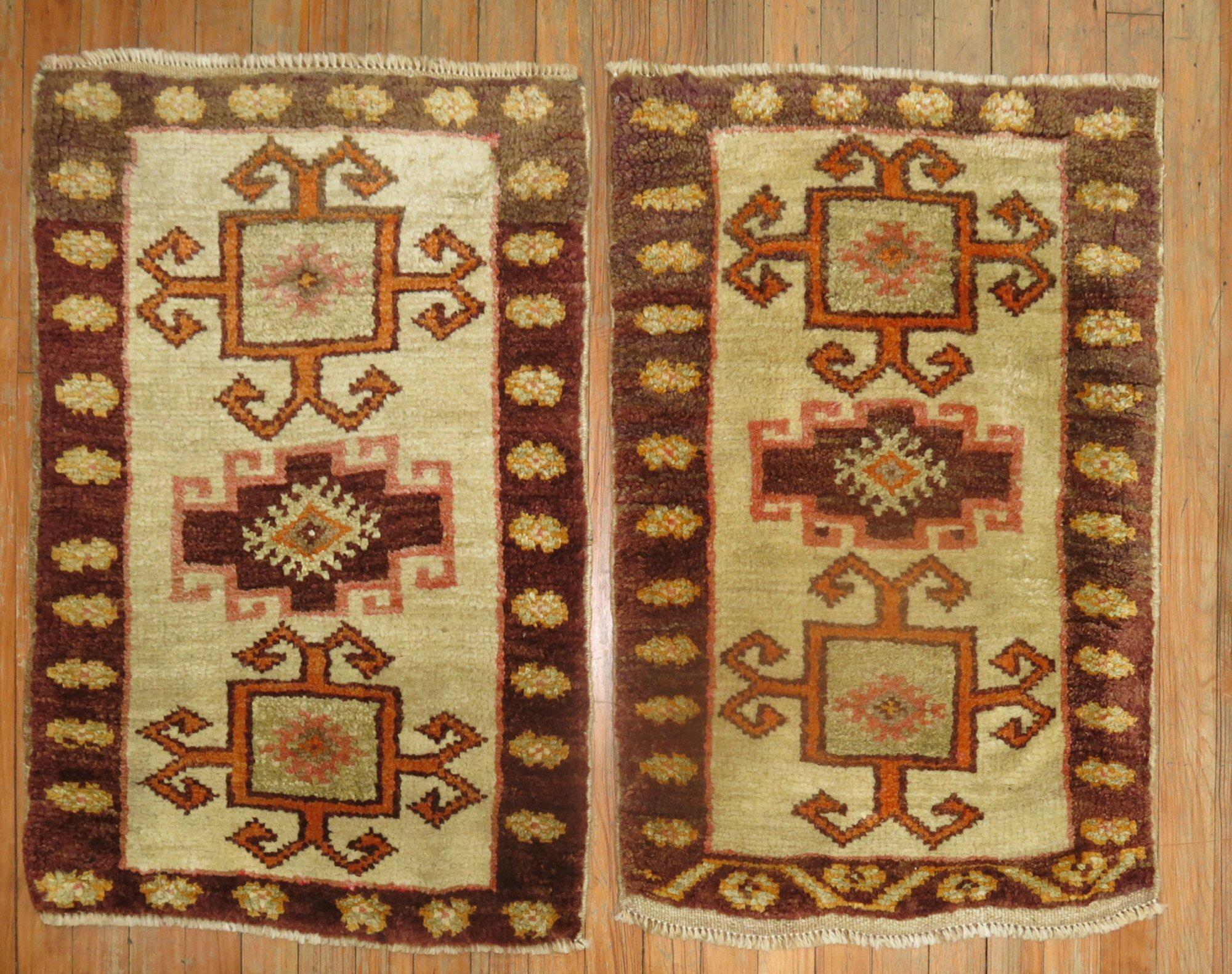 A matching pair of mid-20th century Turkish Kars rugs with tribal motifs

Both Measuring 22” x 33” 