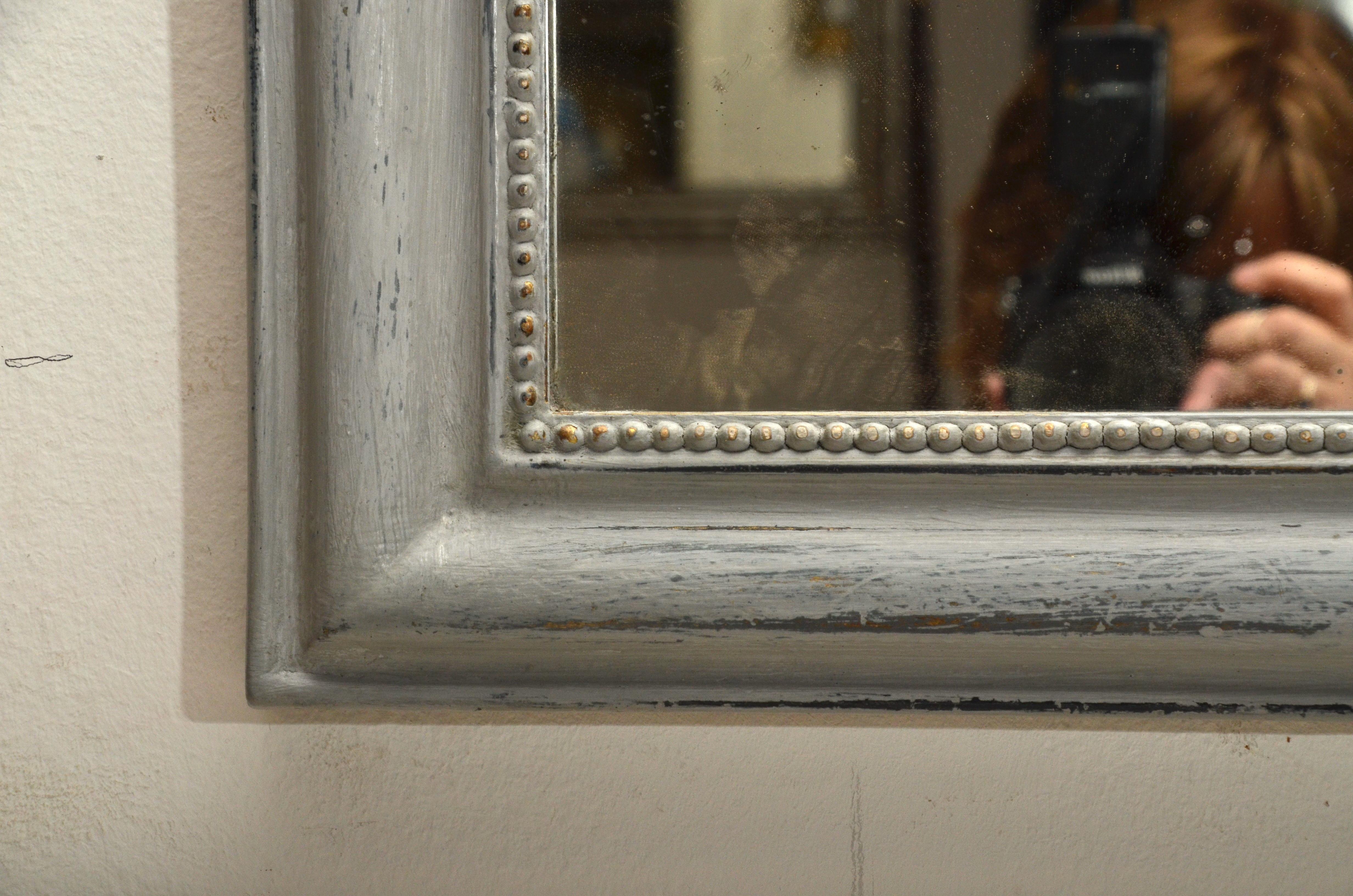 Pair of beaded mirrors, antiqued grey painted, original mercury glass.