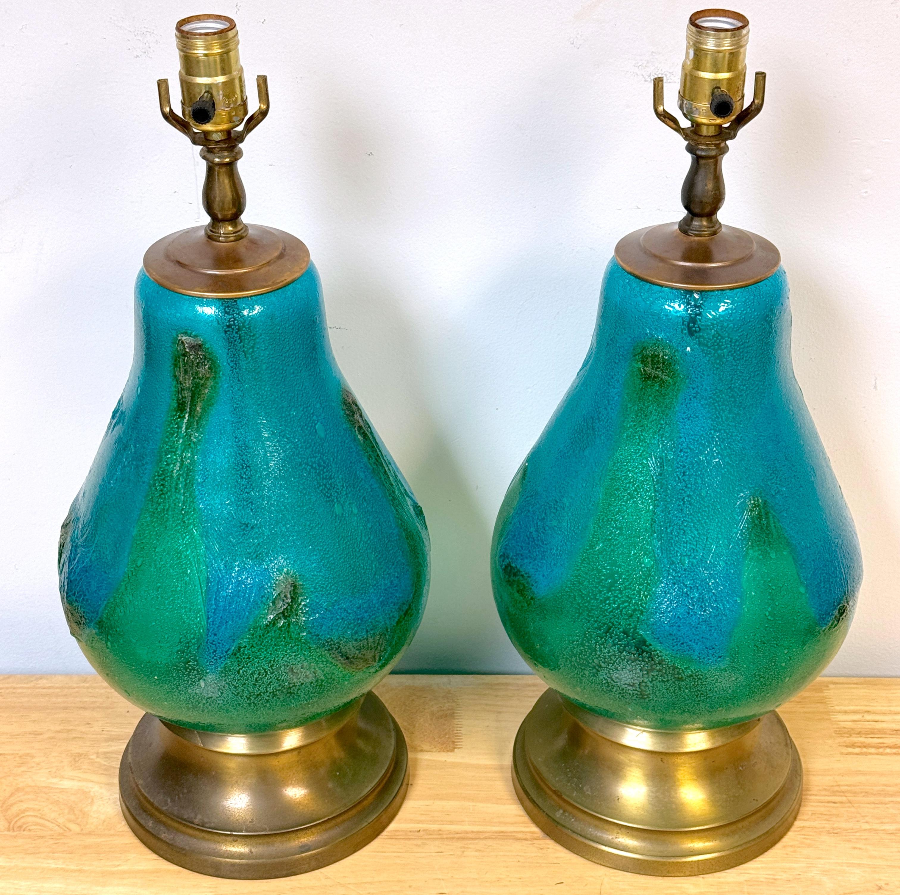 Pair of Turquoise Oceanic Murano Glass and Brass Table Lamps, 
Italy, circa 1960s 
* The last three photos show the lamps with interior lights illuminated; the last photograph was taken in a darkened room. 

Enhance your interior with this stunning