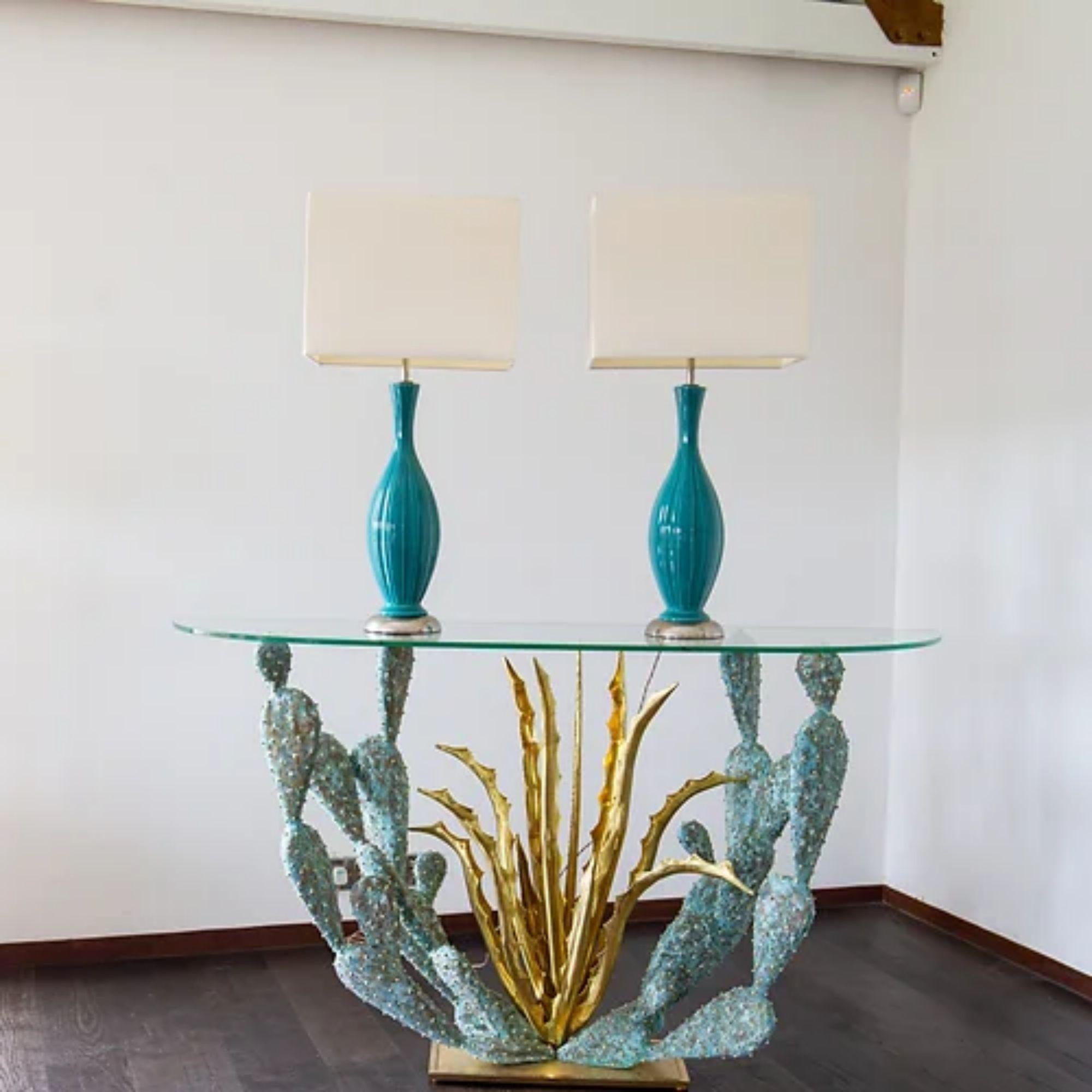 A pair of turquoise ribbed detail ceramic lamps mounted on nickel plated bases, 1960s

Additional information:
Material: Ceramic
Dimensions: 17 W x 90 H cm.