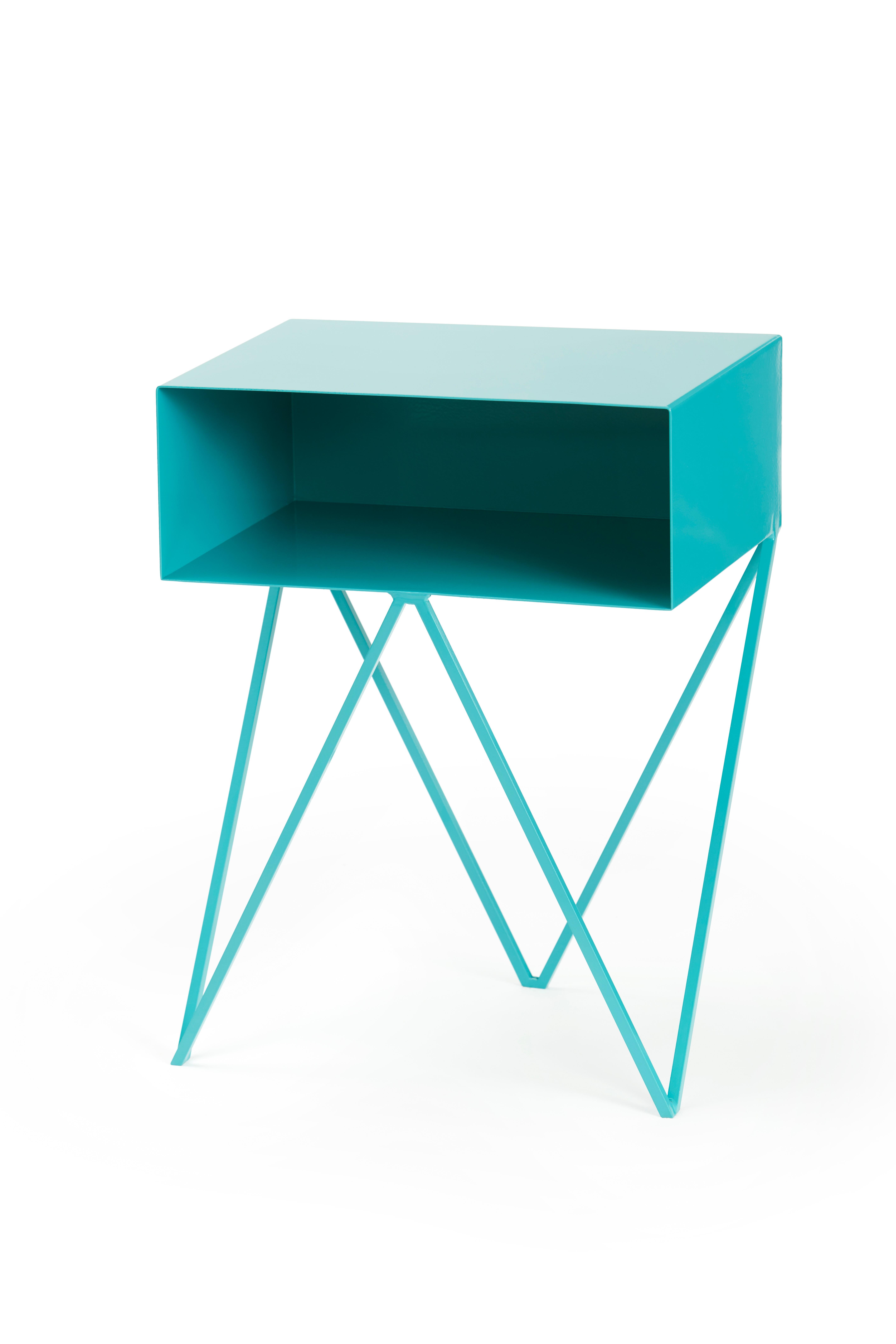 A pair of turquoise Robot bedside tables. The Robot side table features an open shelf on zig zag legs. A fun and functional design made of solid steel, powder-coated in red. The clean lines look great against period details as well as in modern