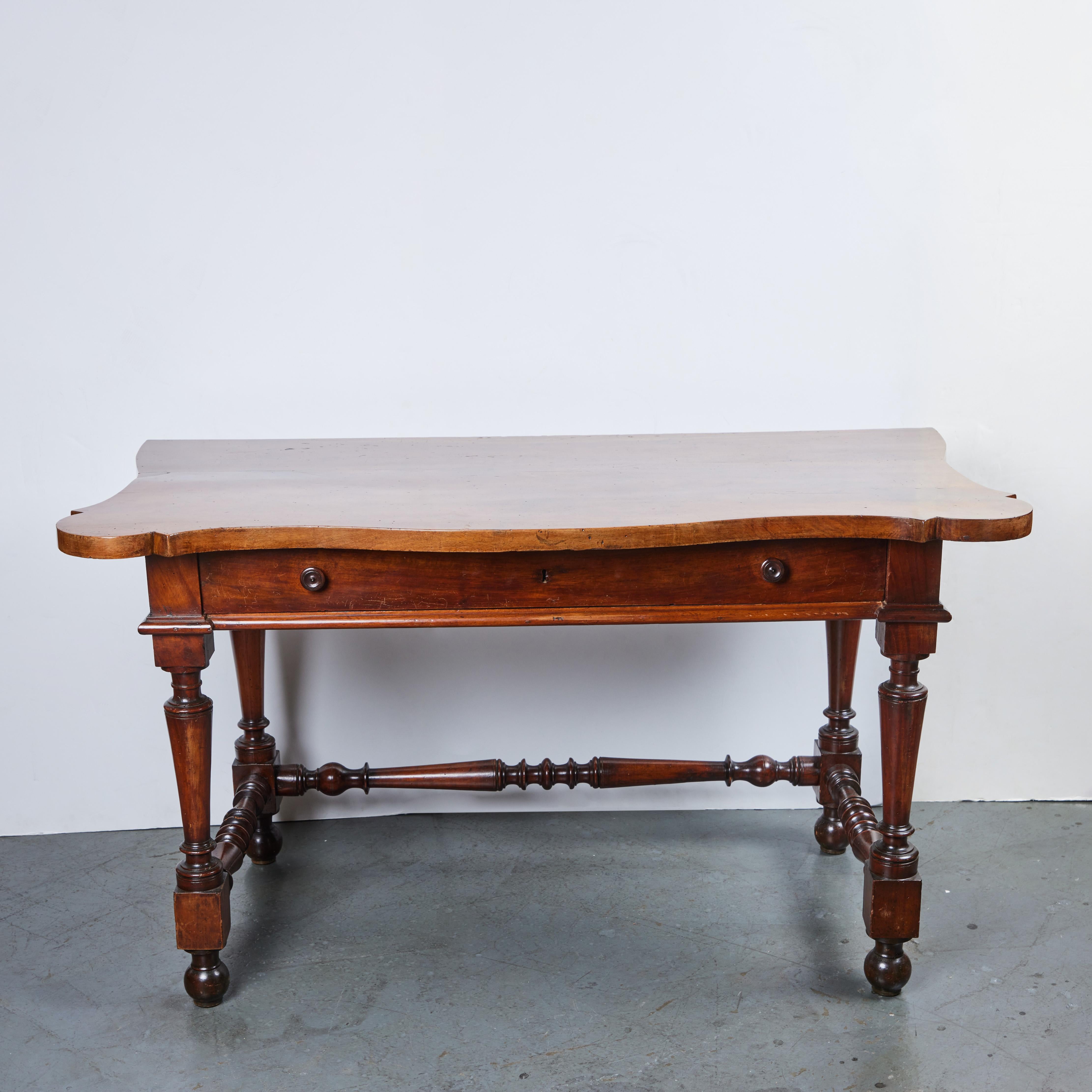 A handsome pair of Tuscan, carved walnut, undulating top consoles with one drawer and turned stretchers, wooden knobs.     