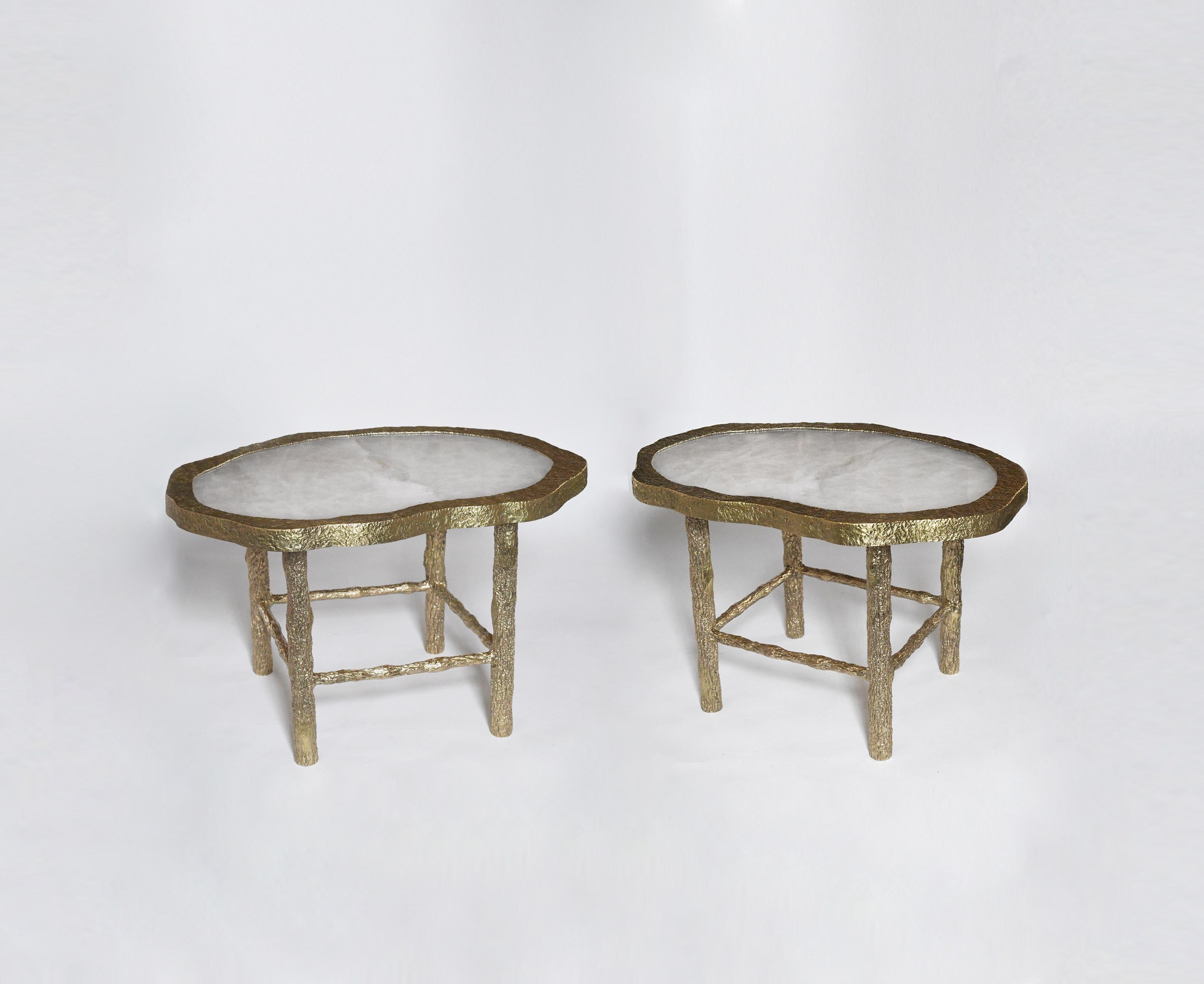 Pair of rock crystal quartz cocktail tables with twig inspired hammered brass legs, created by Phoenix Gallery.
Custom size upon request.
Can be sold by separate.