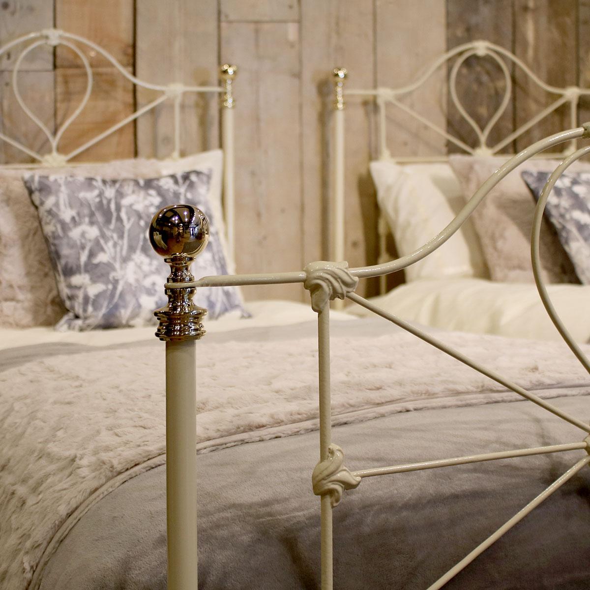A matching pair of brass and iron antique beds finished in cream.

These beds accept 3ft wide (36 inch or 90 cm) bases and mattresses.
The length can be 75 inches, 78 inches or more if required.
These beds can be joined together to form a 6ft wide