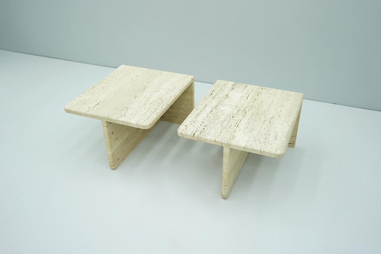 Pair of rectangular twin coffee or side tables made of Italian travertine stone.
Very good condition. Beautiful stone.

Measurements is of one table.