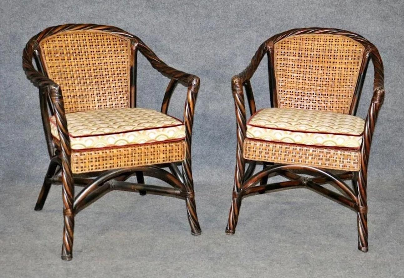 Pair of armchairs with a twist wood style frame and woven rattan back. Removable cushions.
Please confirm location NY or NJ