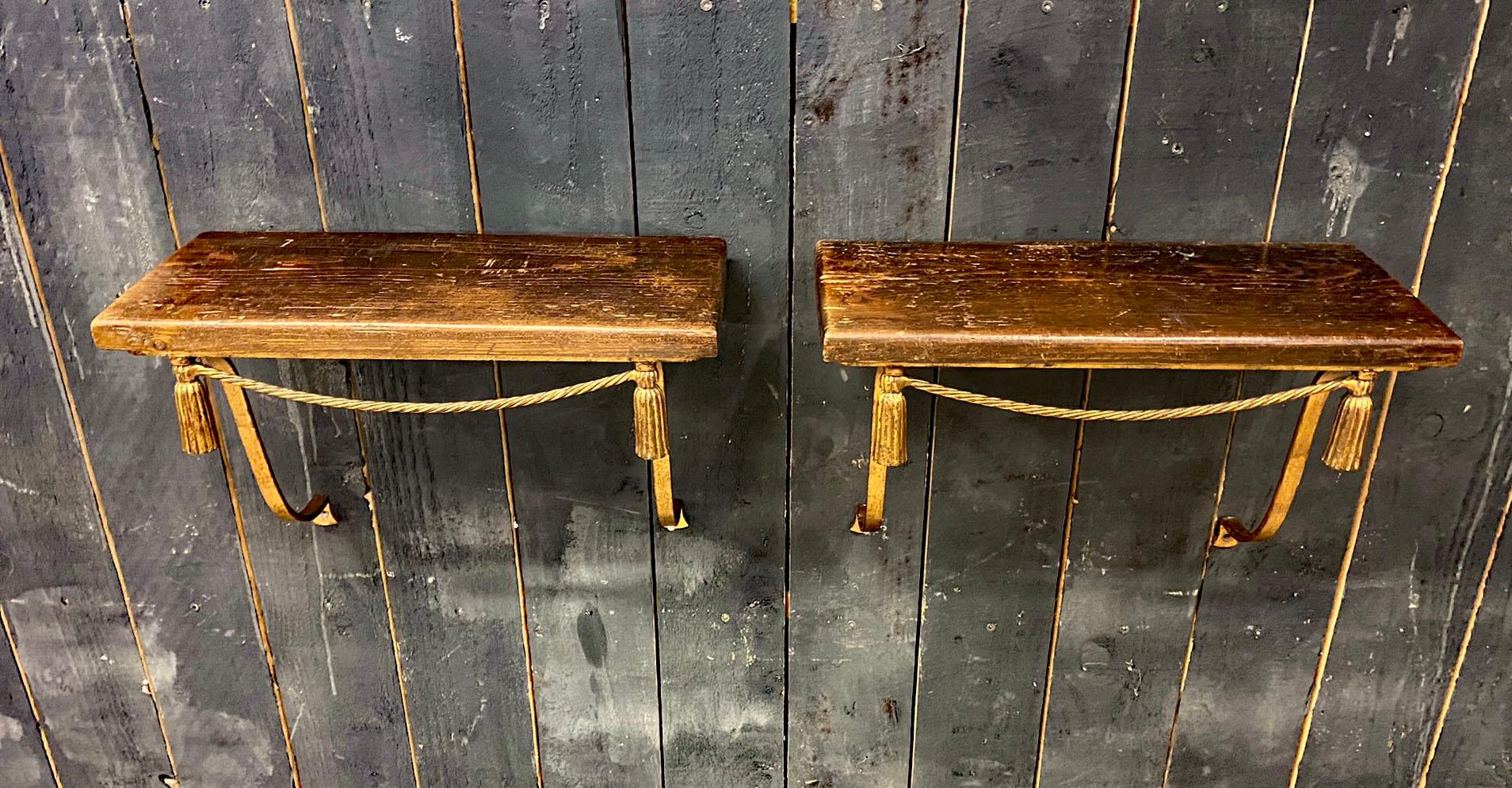 Pair of twisted lacquered iron wall consoles circa 1950.
Patinated pine top.
The trays can be easily replaced, by marble, for example.