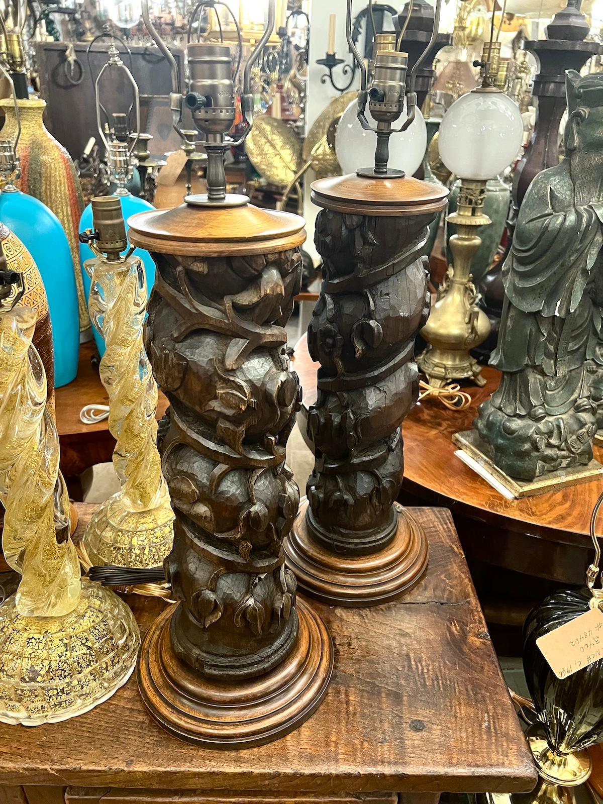 Pair of Spanish circa 1930's carved wood table lamps.

Measurements:
Height of body: 21