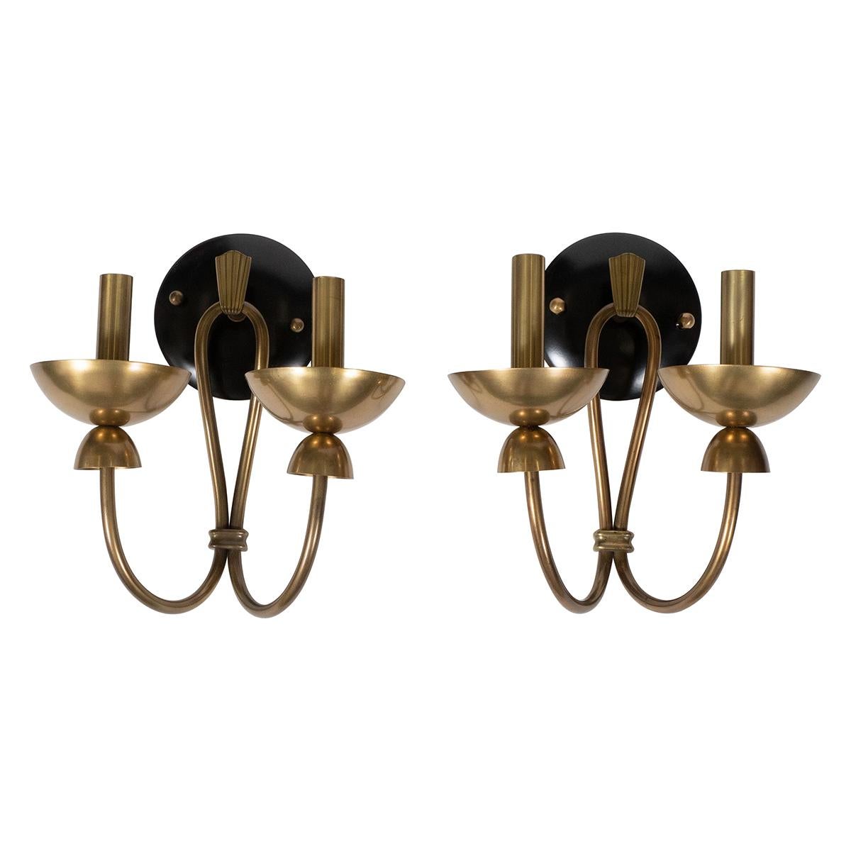 Pair of two-arm brass and enameled metal sconces.