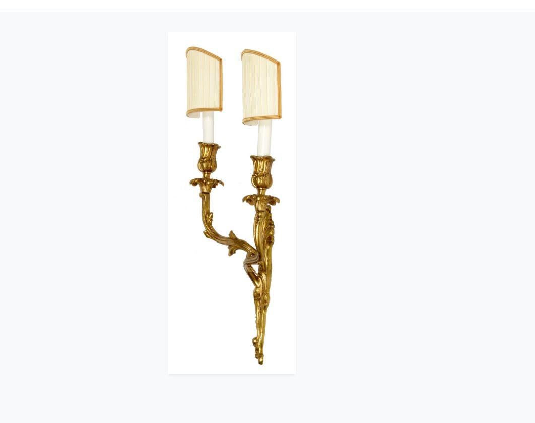 Pair of two-arm Louis XV gilt bronze sconces.