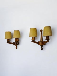 Pair of two-armed art deco wall lights, carved wood, France, 1960