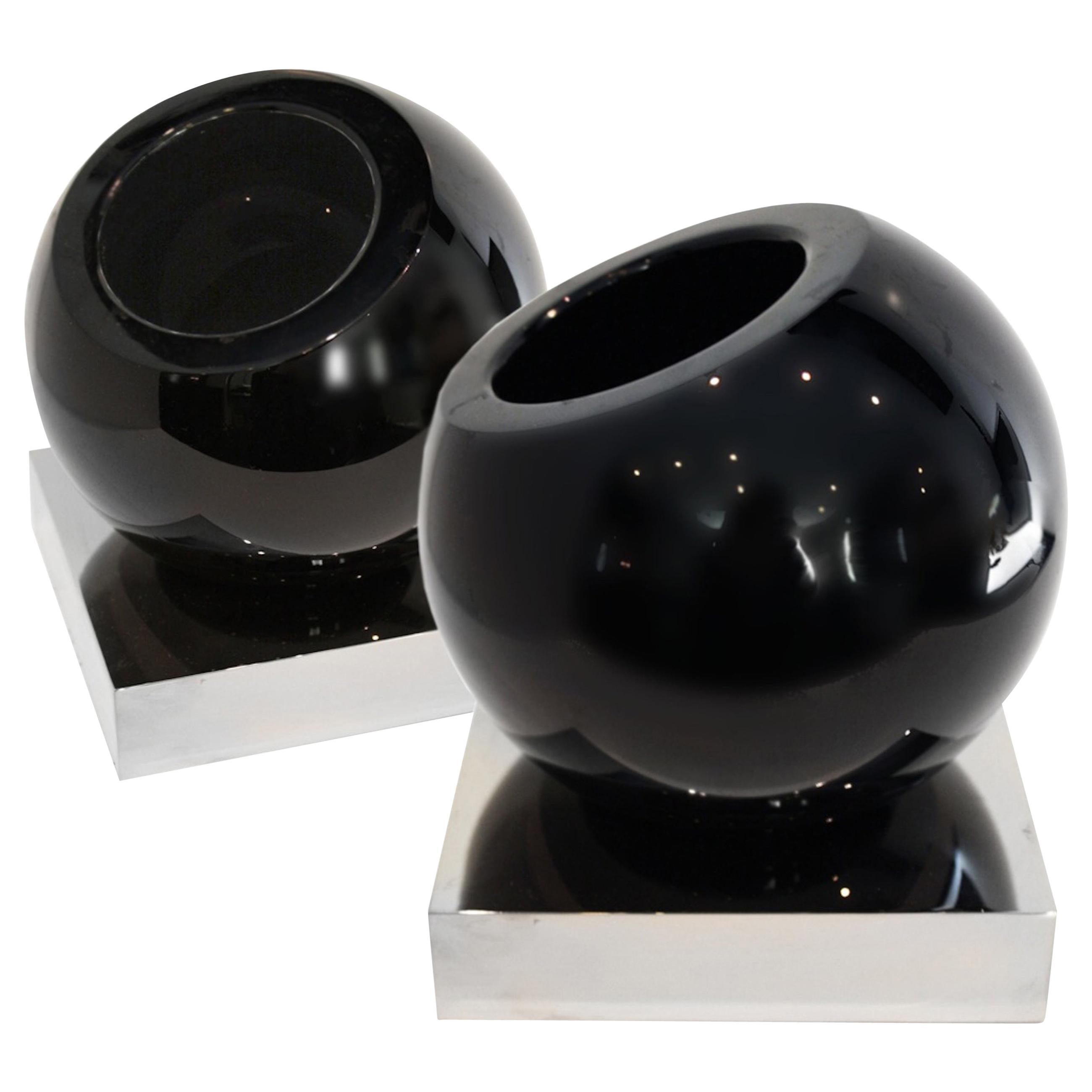 Pair of Two Black Spheric Swinging Vases Sitting on Heavy Nickel Bases For Sale