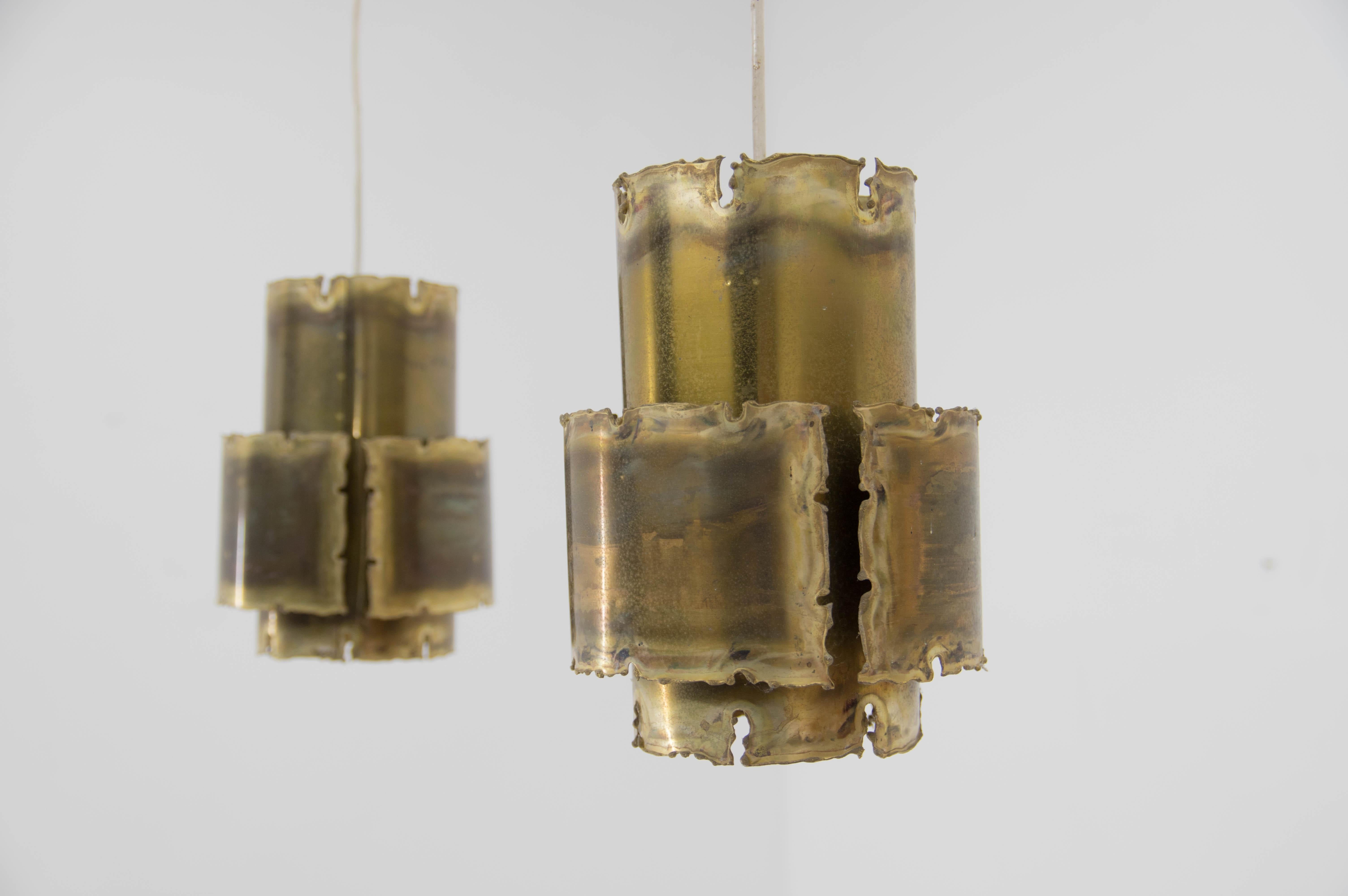 A pair of Brutalist acid treated and torch-cut pendants was designed by Svend Aage Holm Sørensen in the early 1960s. Manufactured by Holm Sørensen in Denmark. 
1x60W, E25-E27 bulb
US wiring compatible.
