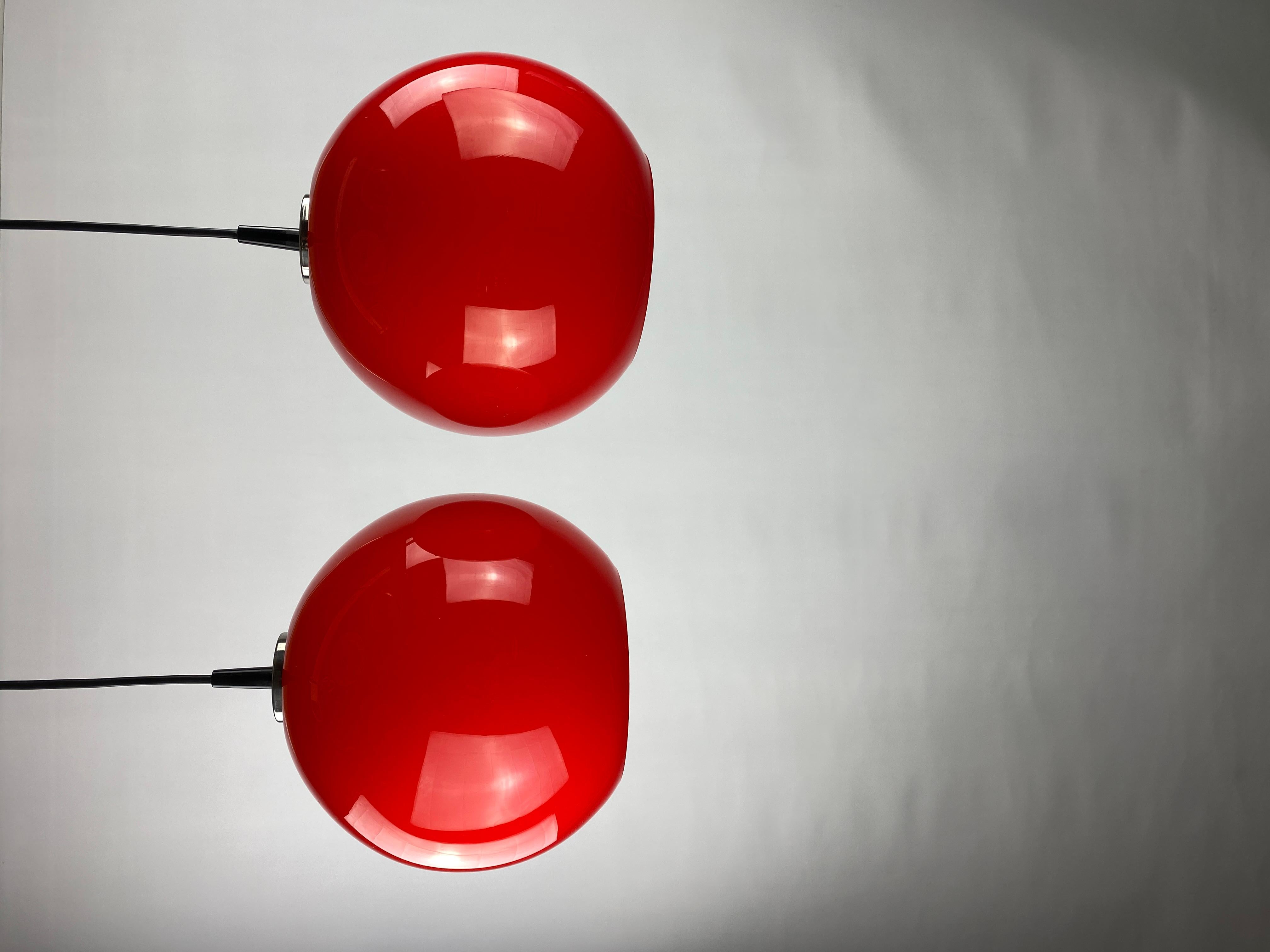 Pair of two cherry red glass Peill & Putzler pendant lights, 1960 In Excellent Condition For Sale In TERHEIJDEN, NB