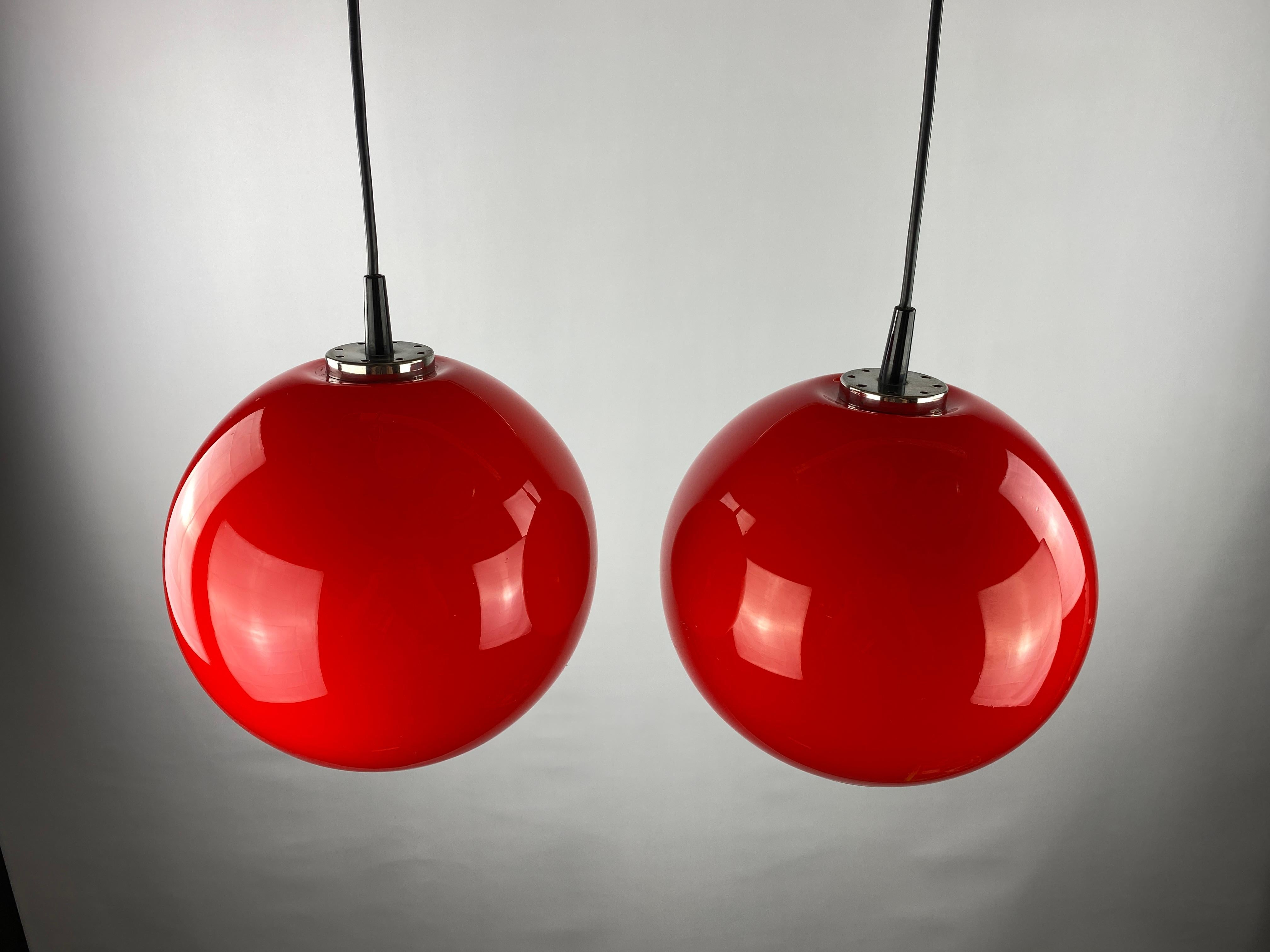 20th Century Pair of two cherry red glass Peill & Putzler pendant lights, 1960 For Sale