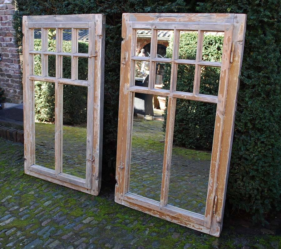 Two pine timber window frames with recent added mirrors.
Remains of old paint in yellow ocre.
The windows have their original working hinges and locks.
These windows originate in an old farmhouse in northern France and date approximately 1910.