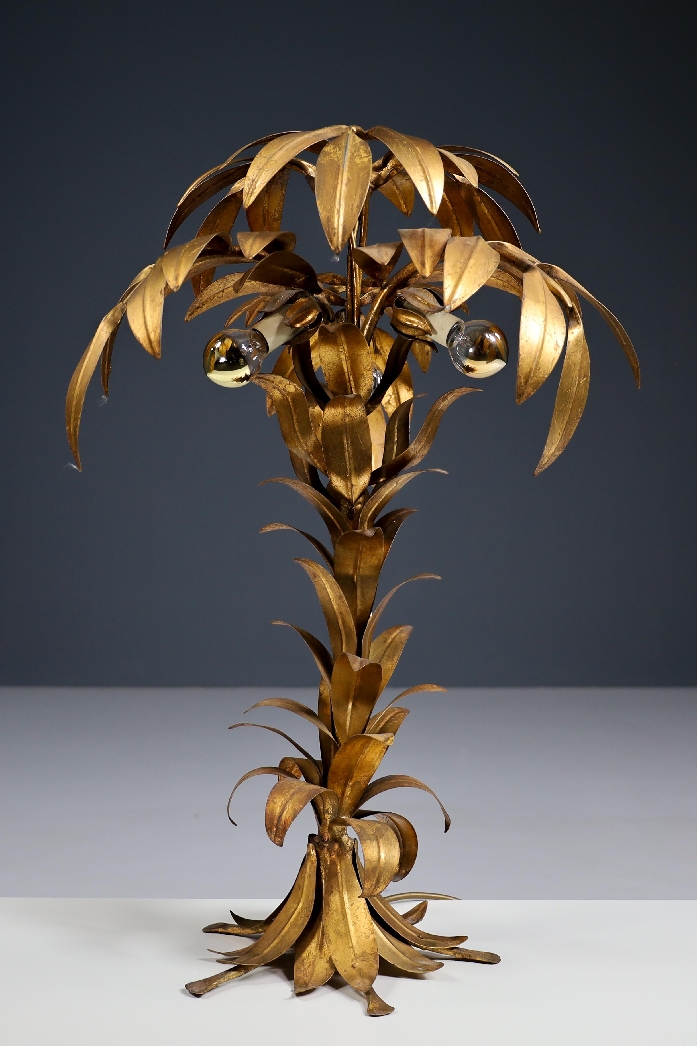Pair of two Gilt Palm tree tables lamp by Hans Kögl, Germay 1970s

Impressive pair of patinated gilt metal palm tree table lamps by German designer Hans Kögl made and designed in the 70s. Three small light points under the leaves give this design