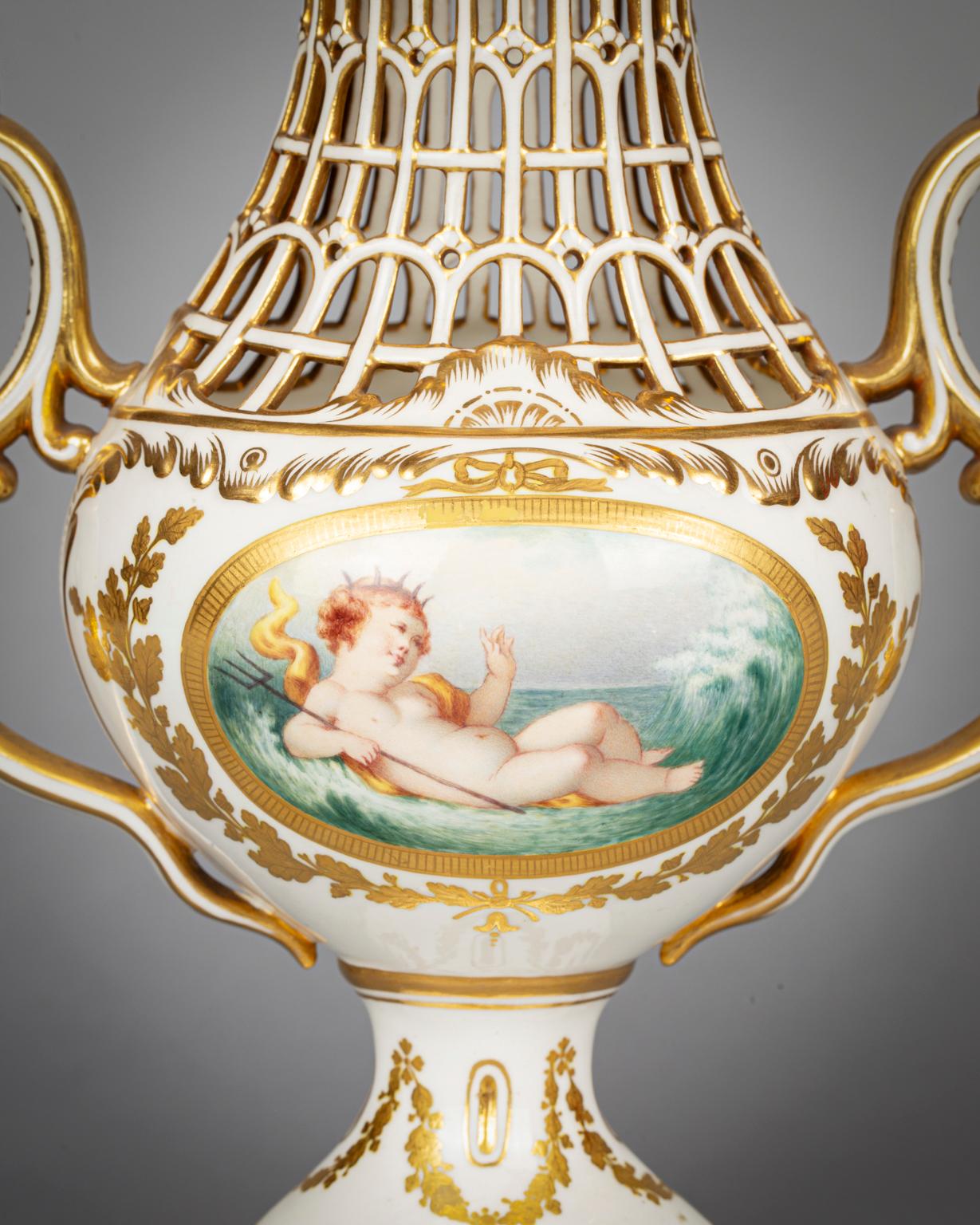 Of egg-shell porcelain in Sevres and/or Chelsea style, with four panels of finely painted of Putti in various pursuits, the shoulder and cover with interlaced openwork, dolphin finials. Condition: one inner flange of cover with minor damage.