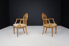 Pair of two Hepplewhite-style open-arm chairs in Satinwood, England 1880s
