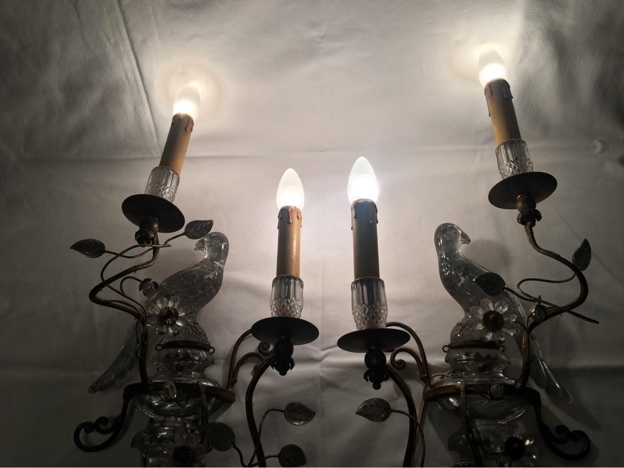 A lovely set of sconces from France. With crystal glass parakeet flowers and leaves reminiscent of the style of Maison Baguès. They still have the paper hull sleeves on the solder spots. The right lamp is about an inch longer since the arm is a bit
