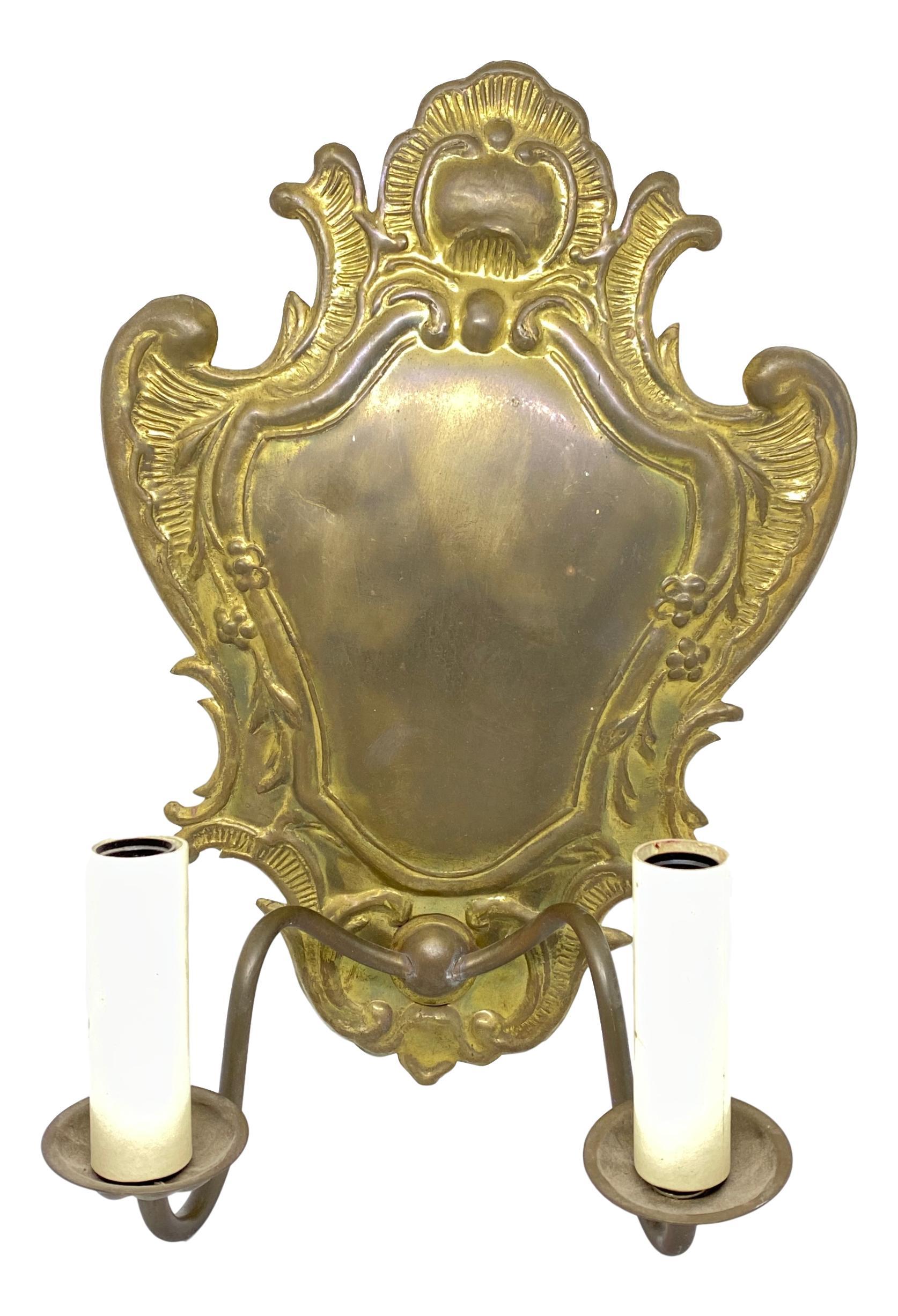 Pair of beautiful sconces. Made of brass in Germany in the 1960s. Great size and stunning design. Brings a touch of elegance to the room. Each fixture requires two European E14 / 110 volt candelabra bulbs, up to 40 watts each socket. The brass has a