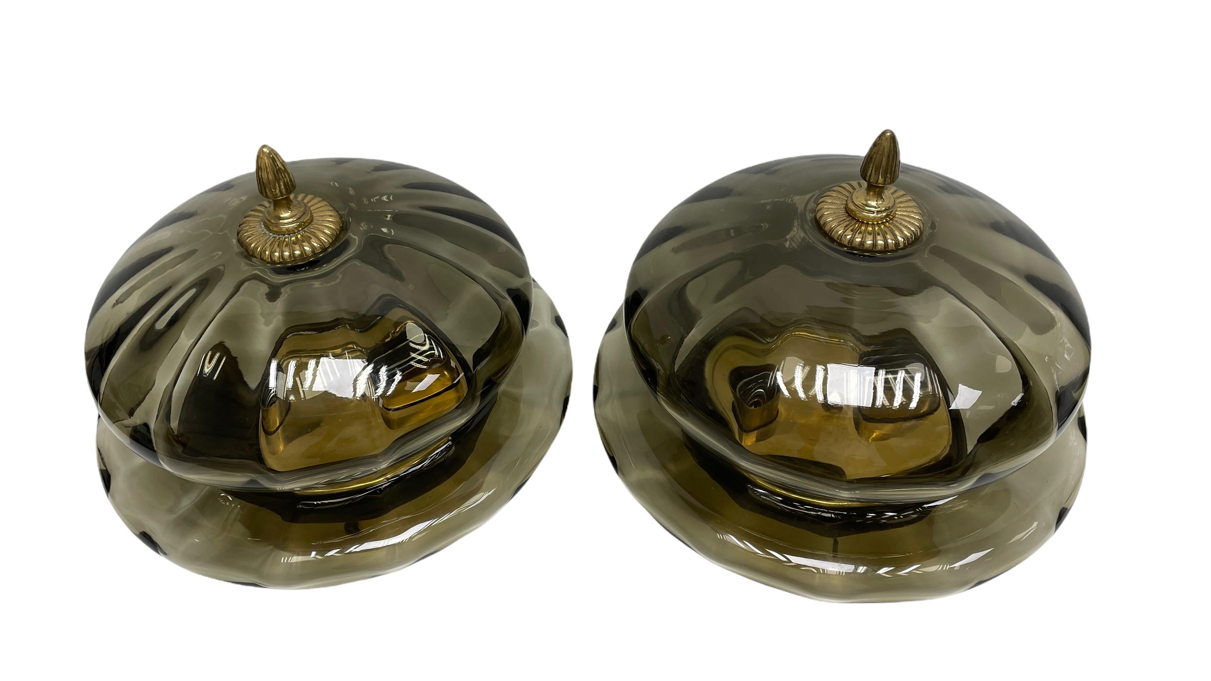 A beautiful pair of gorgeous glass flush mount made by Hillebrand Leuchten Germany. It can be used also as a sconce or wall light. Each light fixture requires two European E27 bulbs, up to 60 watts each socket. Grey Smoked glass, mounted on a brass