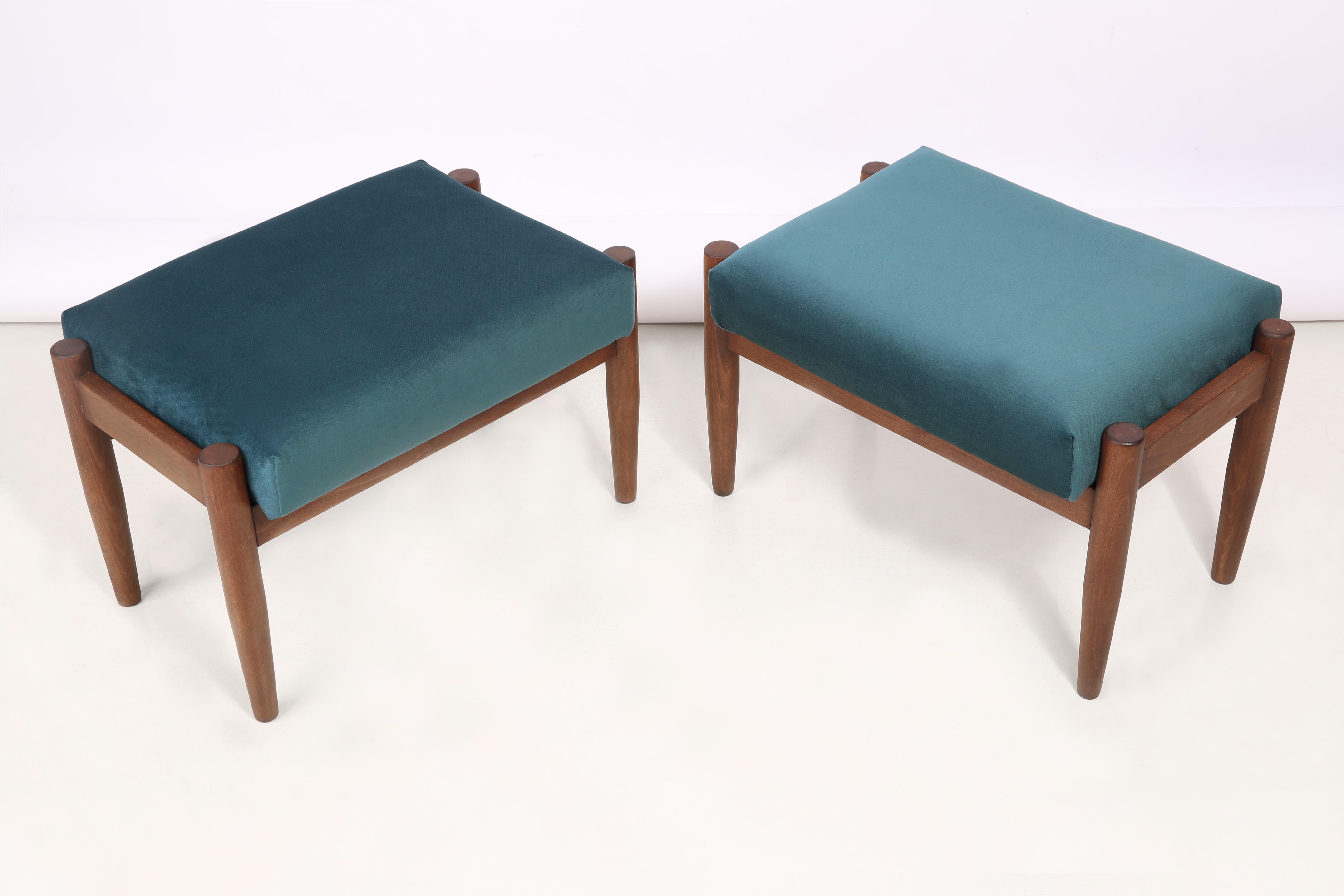 Stools from the turn of the 1960s. They was designed by Edmund Homa, a Polish architect, designer of Industrial Design and interior architecture, professor at the Academy of Fine Arts in Gdansk. Beautiful petrol blue high quality velvet upholstery