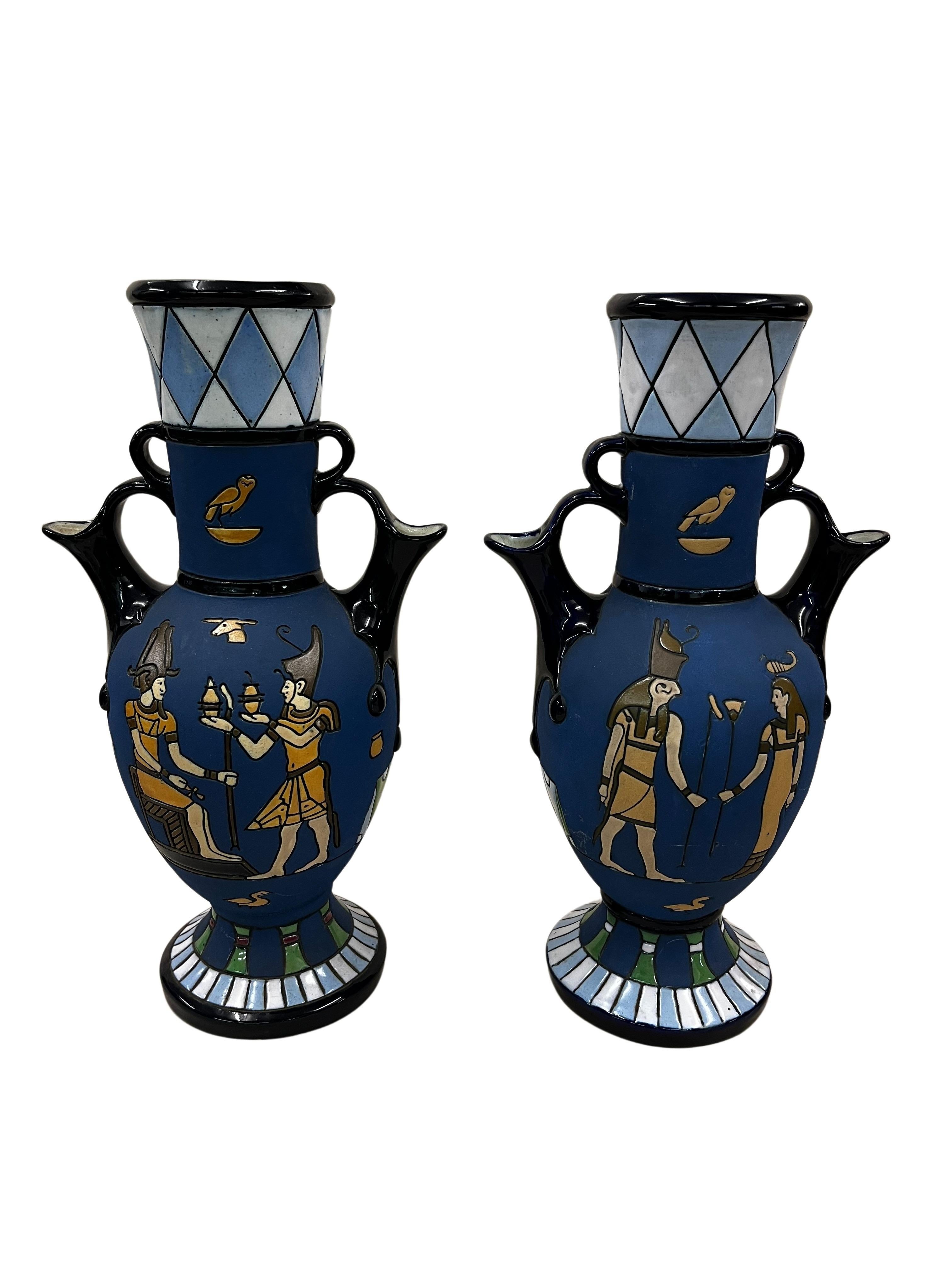 Pair of very rare vases / jugs by wellknown manufacturer Amphora, which can be used on both sides, made around 1915 in Czech Republic. 

The extraordinary pair is of the same size and decor but slightly different colors. Both have a blue - white