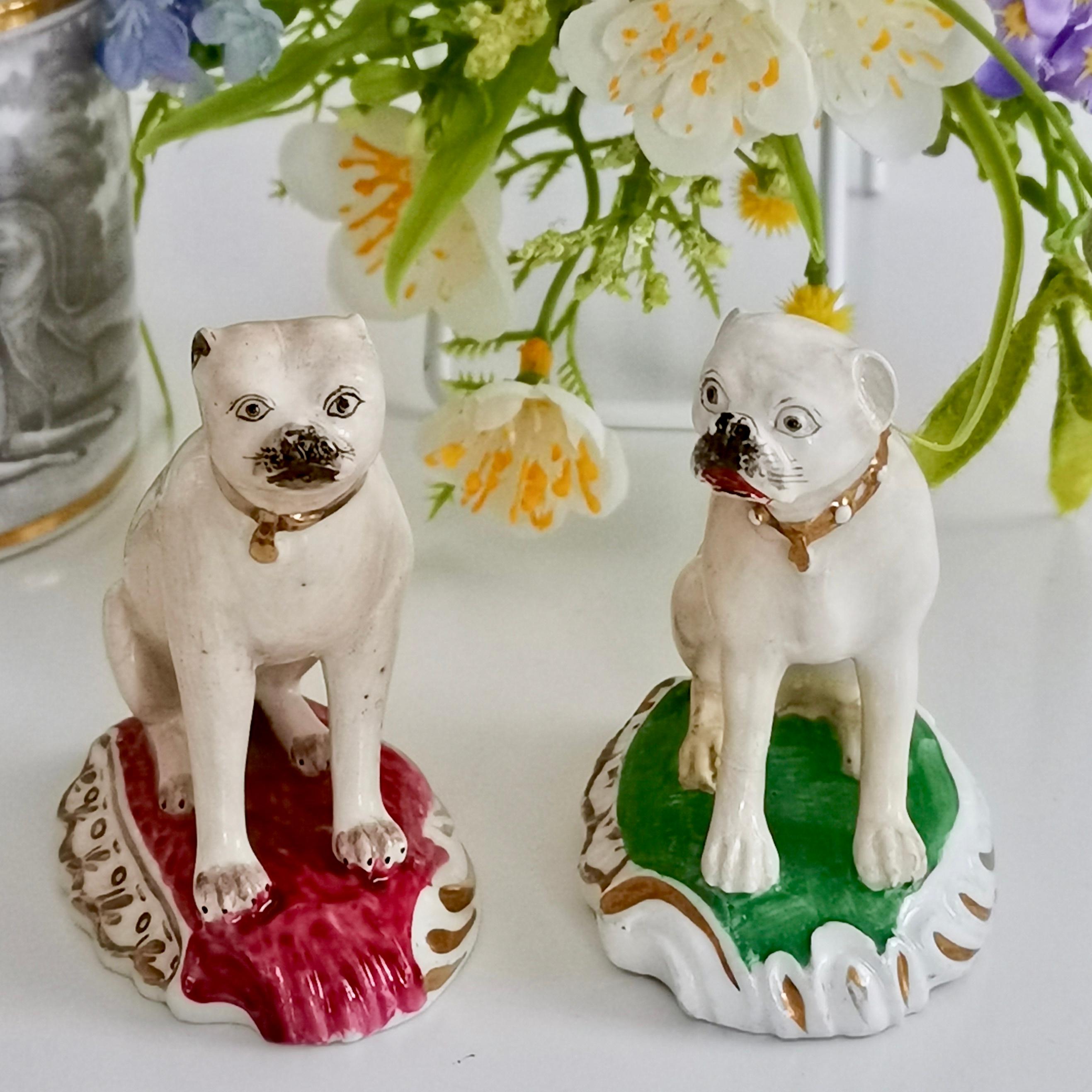 This is an adorable pair of porcelain pug dog figures, made by Rockingham in circa 1835, which was the late Regency era. 

Although the Rockingham pottery started some time in the mid-18th century, when we say 