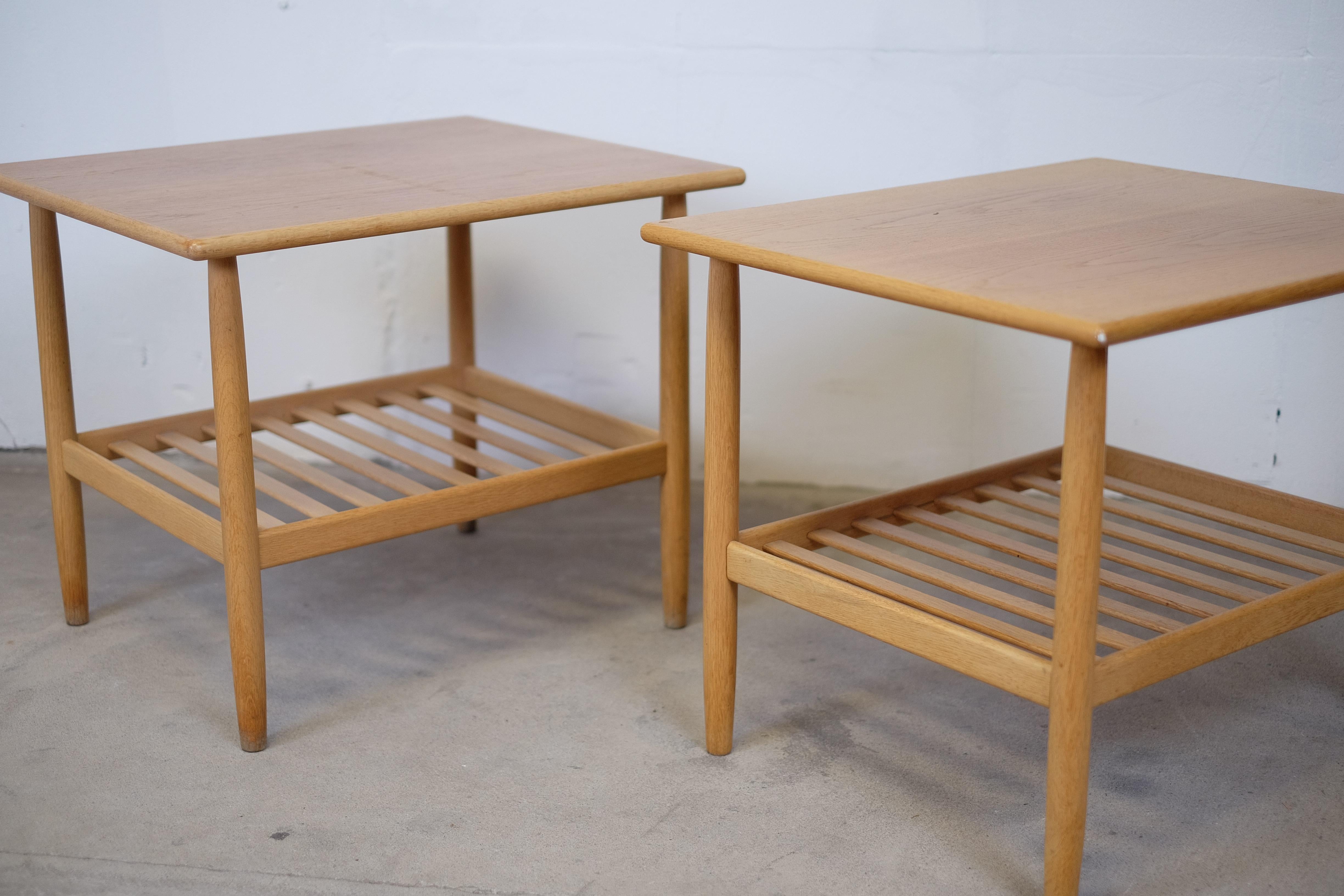 A beautiful pair of side tables by one of the top designers for FDB > Ejvind A. Johansson

A pair you just can't split up, suitable as a small coffee table, bedside table, in the corner with a flower on etc. Many possibilities. 

Both tables are