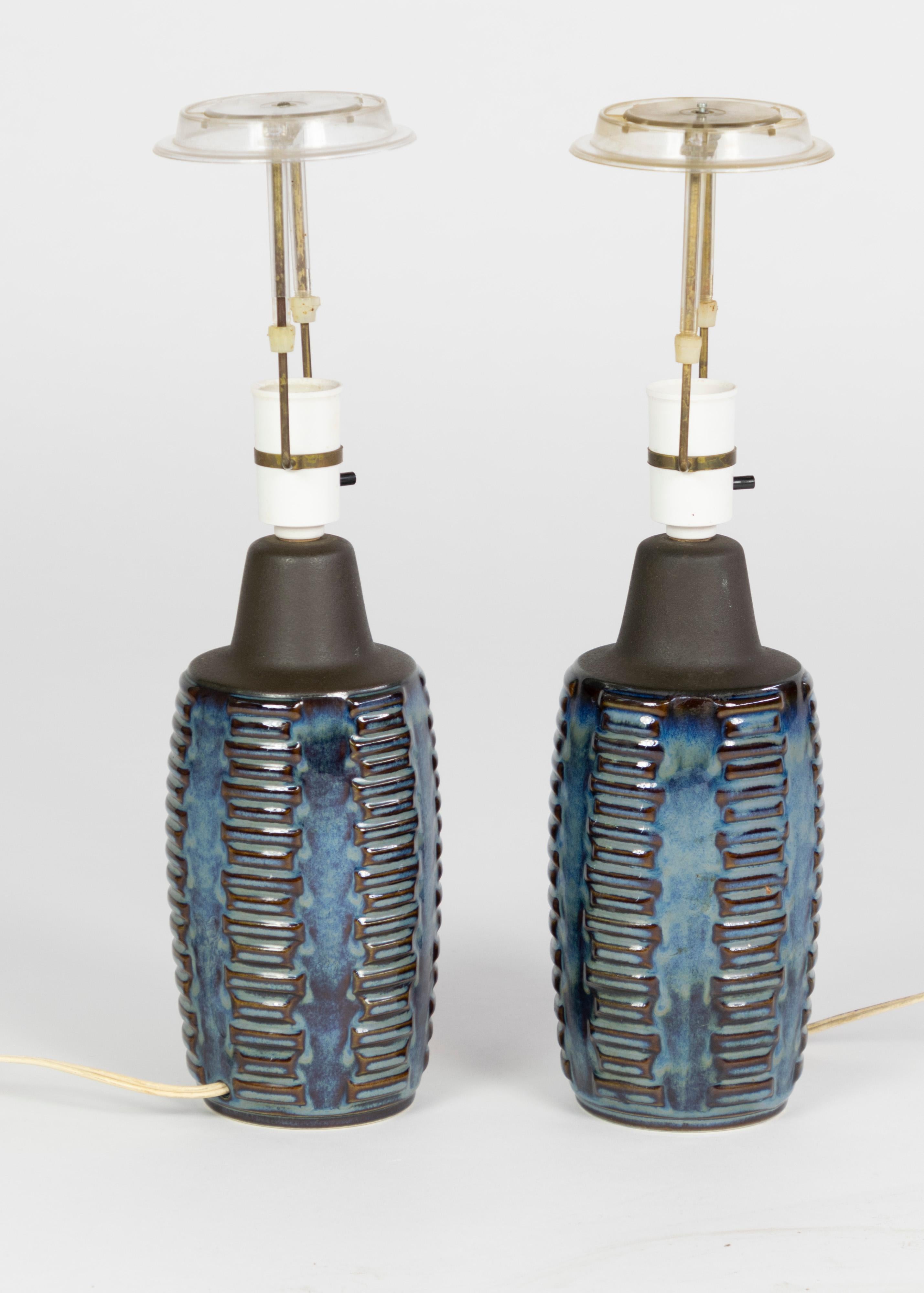 Pair of midcentury table lamps in blue ceramics by Einer Johansen for Soholm. 
Manufactured in the 1960s.
Very nice condition, signed under the stam, original shade holders are included. 

 