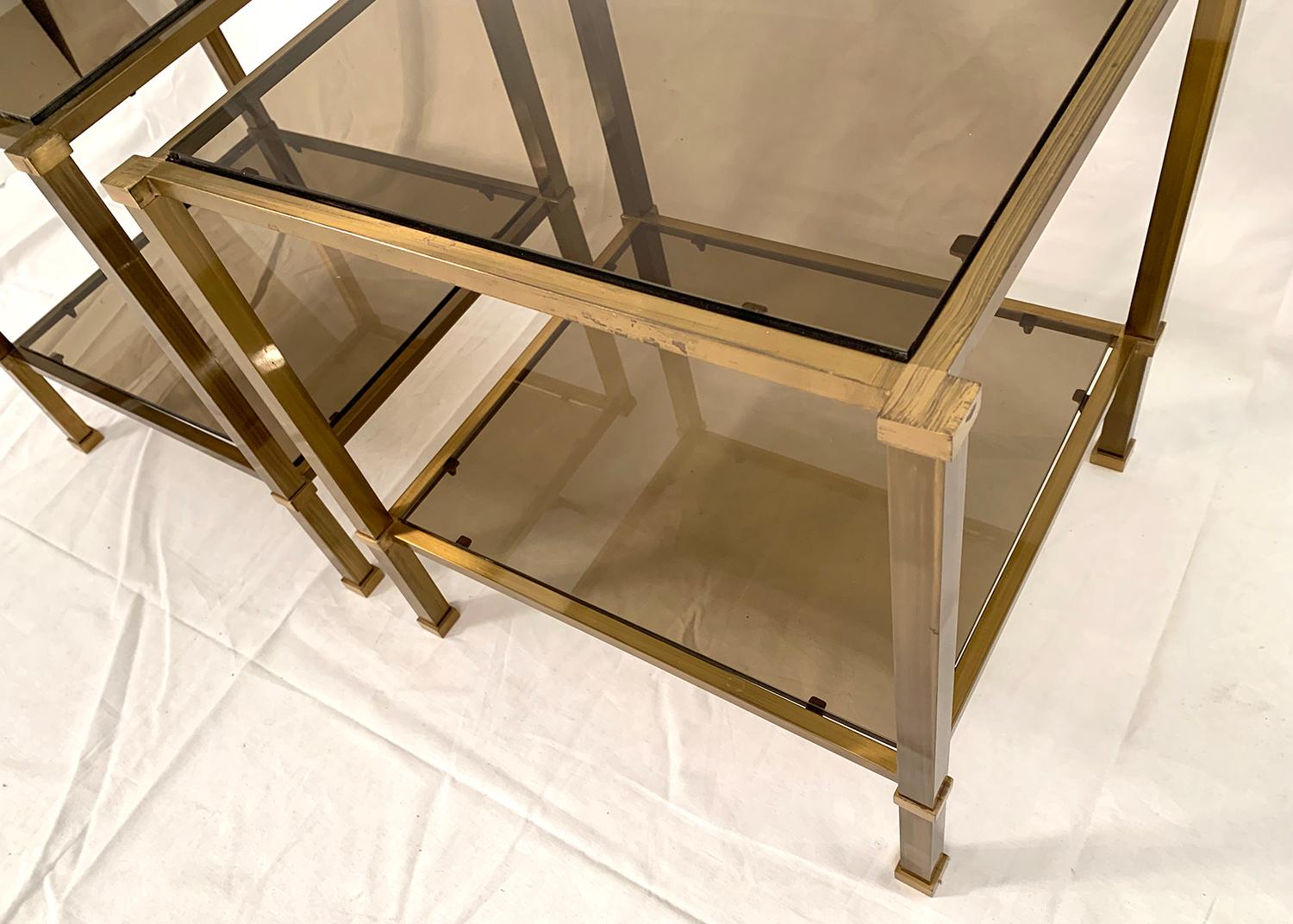 Mid-Century Modern Pair of Two-Tier Brass and Smoked Glass End Tables For Sale