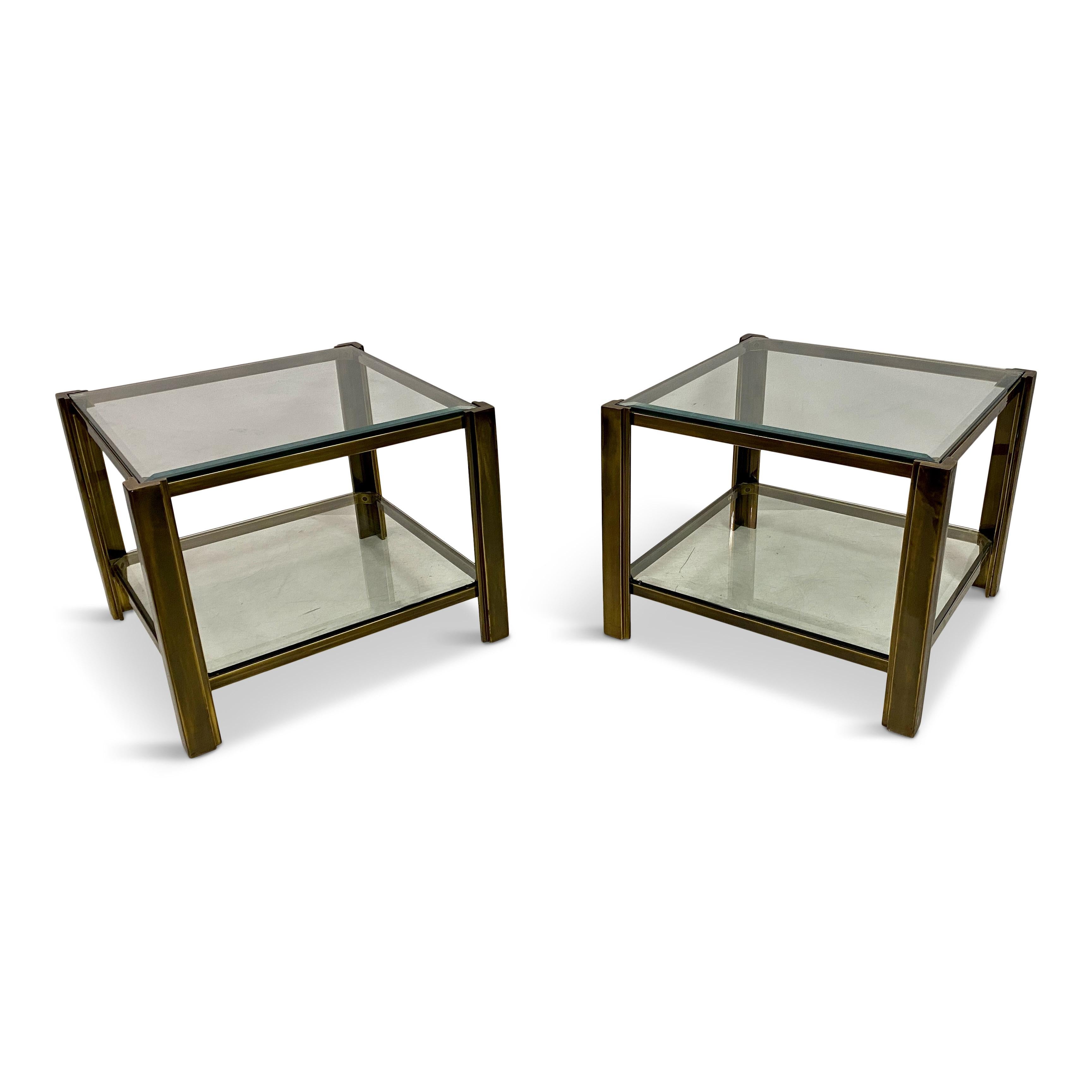 Pair of side tables

Brass 

Very heavy so possibly bronze

Two tier

Bevelled glass shelves

Late 20th Century