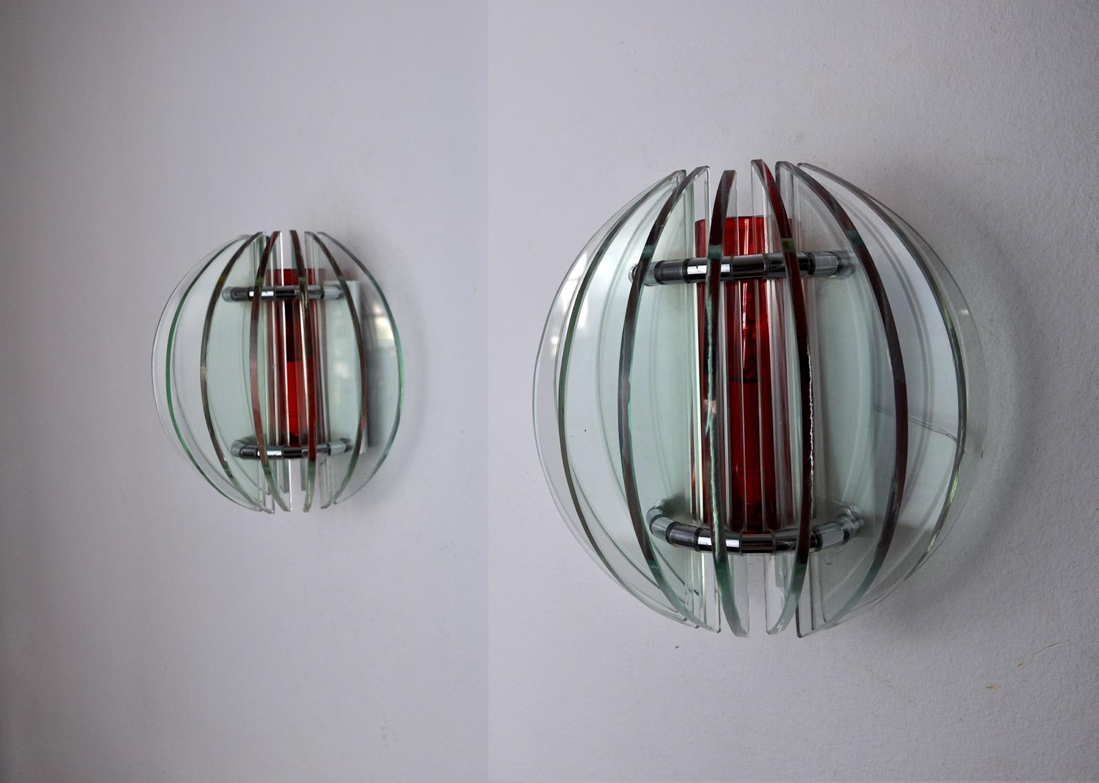 Very nice pair of veca sconces produced in italy in the 70s. Sconces composed of two-tone murano glass crystals, from which the central red crystal can be removed. White metal structure. Unique object that will illuminate wonderfully and bring a
