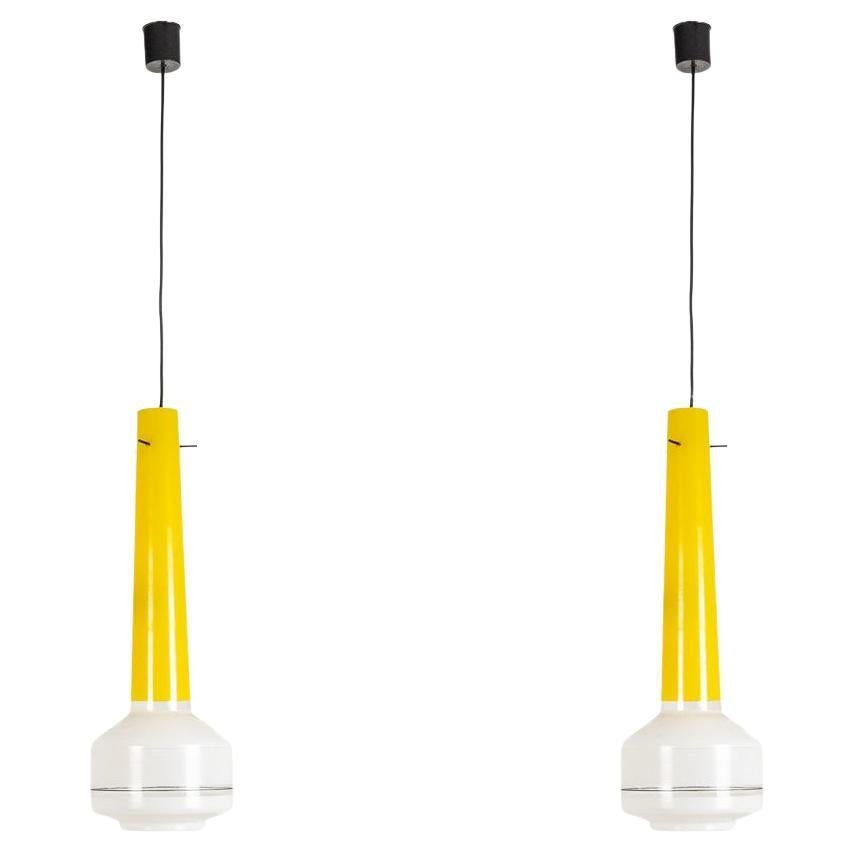 Pair of two-tone yellow and white glass pendant lights. 1960s